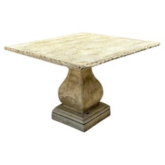 Mesa de comedor vintage con pedestal y tablero cuadrado de piedra