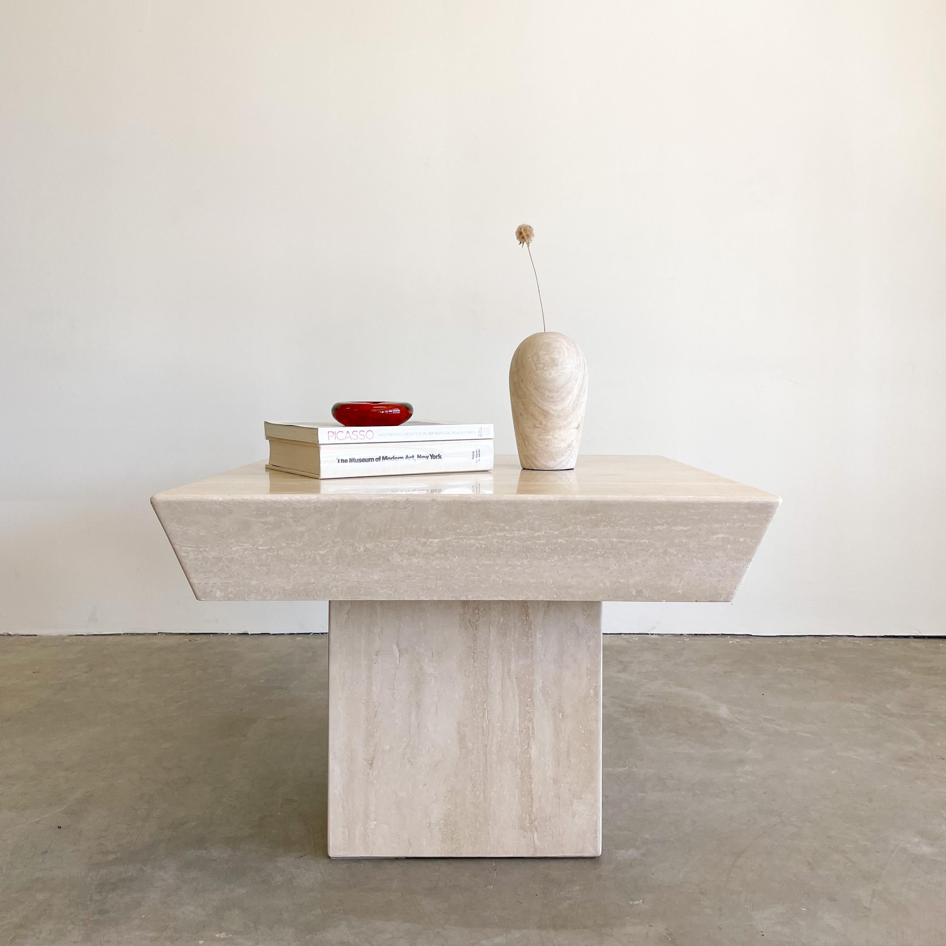 Vintage 80s Cream Travertine End Table.

The table is made out of a beautiful shade of light cream travertine. 
The travertine holes have been filled. 
The pattern is stunning. The table is honed and has no shine. 
The travertine is solid and very