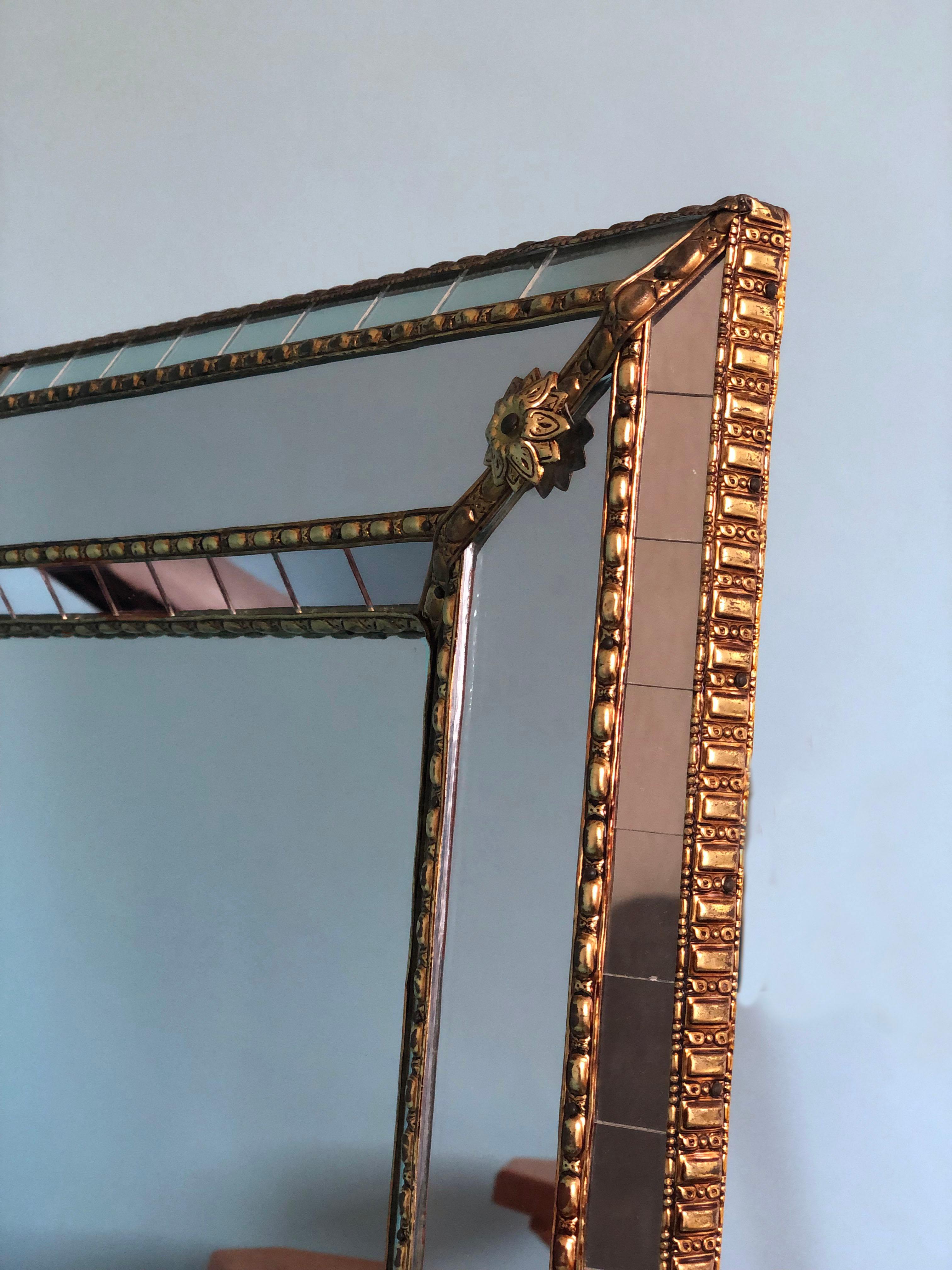 Beautiful Spanish square mirror with a Venetian glass frame with a brass golden strip. The frame is made with small crystals both on the outside and inside, and larger ones in the center line. The brass strip holds the mirrors together.

Handmade