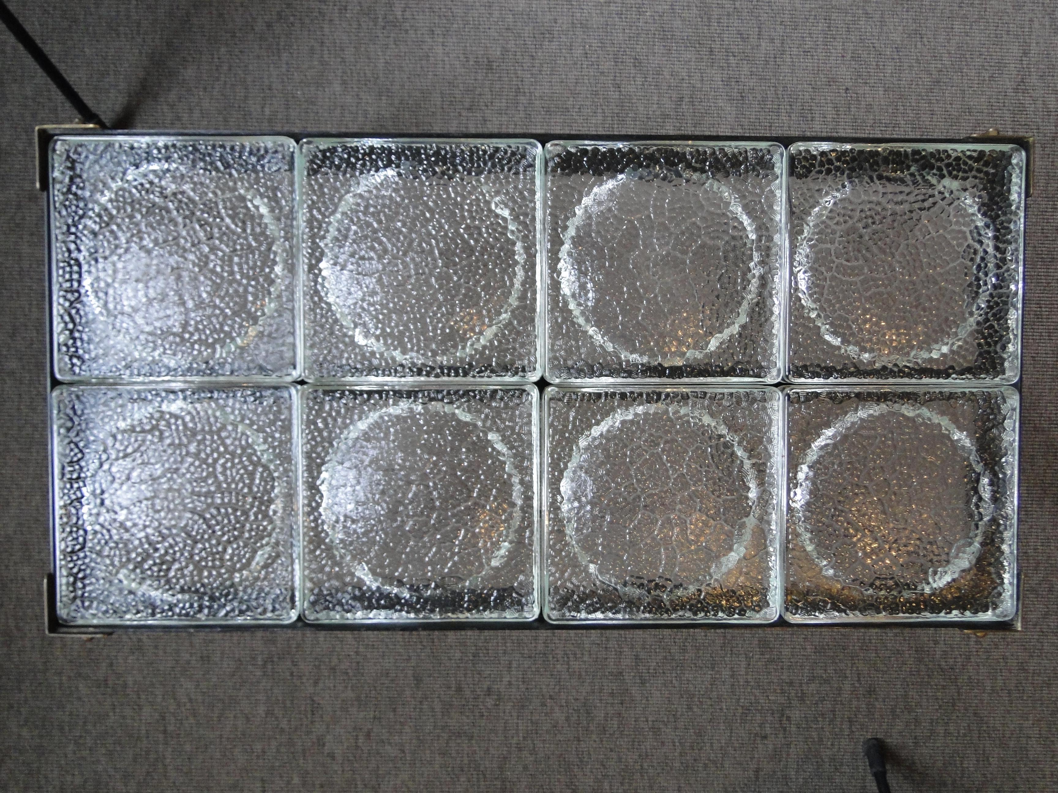 Coffee table with glass top. France, circa 1950.
Black lacquered metal, glass, brass.
8 Saint Gobain glass tiles
Very good condition.
Bibliography / similar model reproduced in: Hardy & millet, Jacques Adnet, p.202.