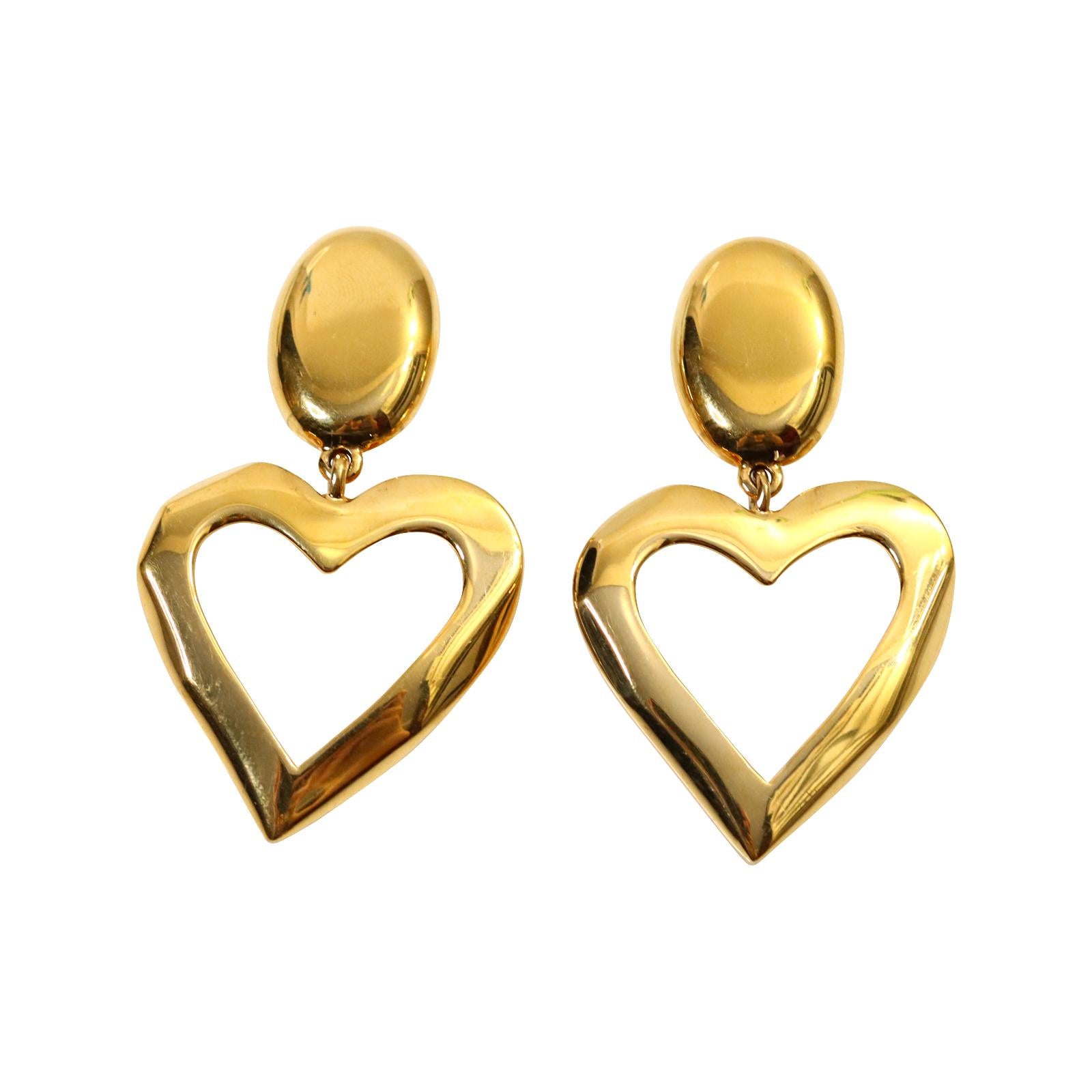 Vintage St John Gold Dangling Heart  Earrings Circa 1990s. St John made some great jewelry.  These dangling gold hearts look so chic and stunning with everything.  Substantial and well made. Clip On.  These will make everything look put together.