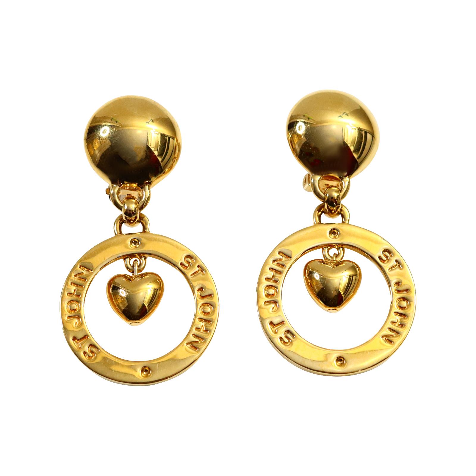 Vintage St John Gold dangling Heart Hoop Earrings Circa 1980s. St John made some great jewelry in the 1980s.  These dangling gold hearts look so chic and stunning with everything.  Substantial and well made. Clip On.