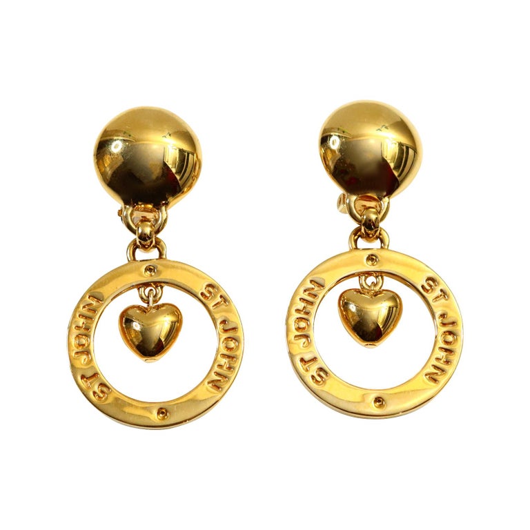 Vintage St John Gold dangling Heart Hoop Earrings Circa 1980s. St John made some great jewelry in the 1980s.  These dangling gold hearts look so chic and stunning with everything. Clip On.