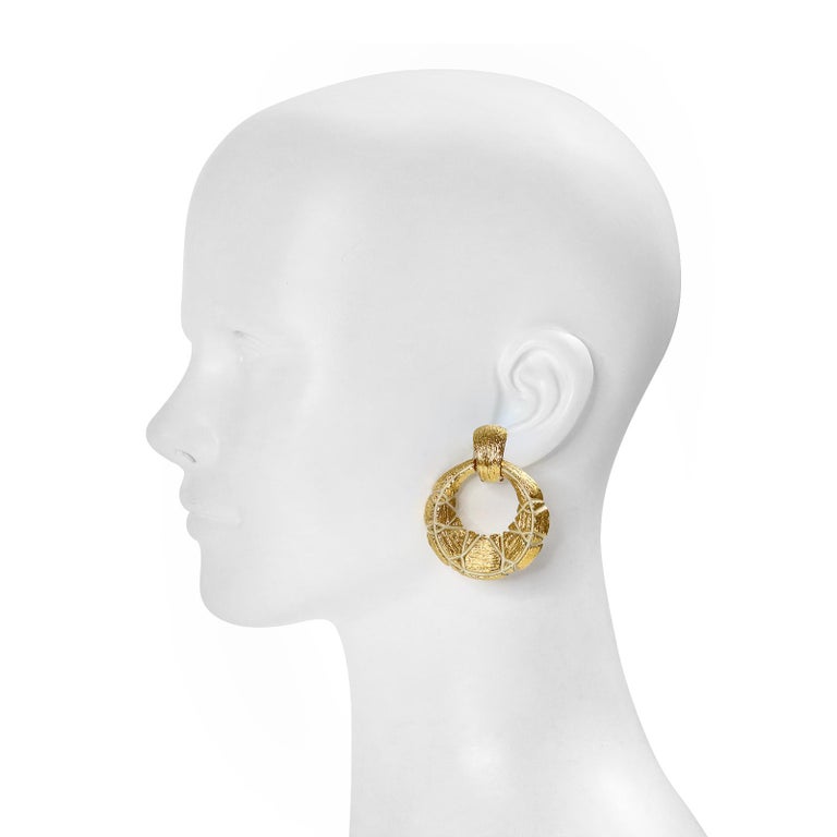 Vintage St John Gold Tone Textured Hoop Earrings. Front Facing Earrings. The texture is broken with a cream enamel. 2
