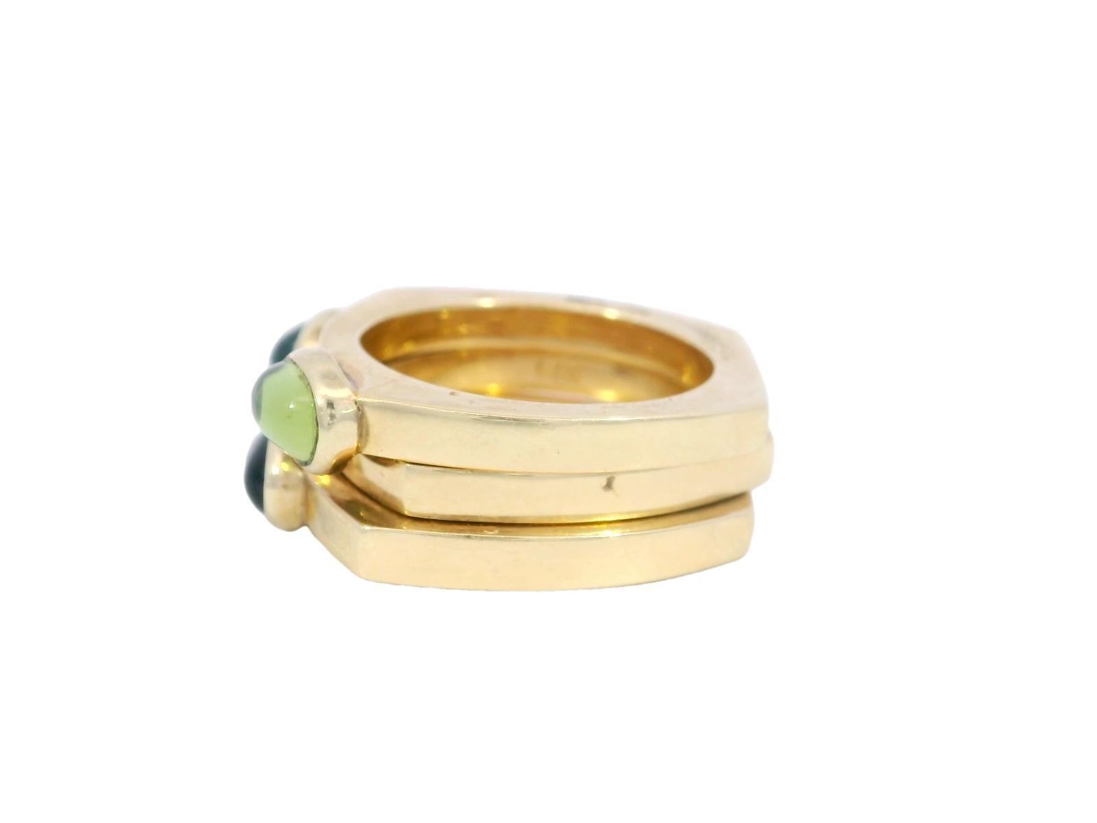 Anello vintage impilabile con castone di pietre preziose e anello zingaro in tre pezzi in oro giallo 14k

Questo splendido set di tre anelli in oro giallo 14K è una celebrazione del colore e del design raffinato. Ogni anello presenta una vibrante