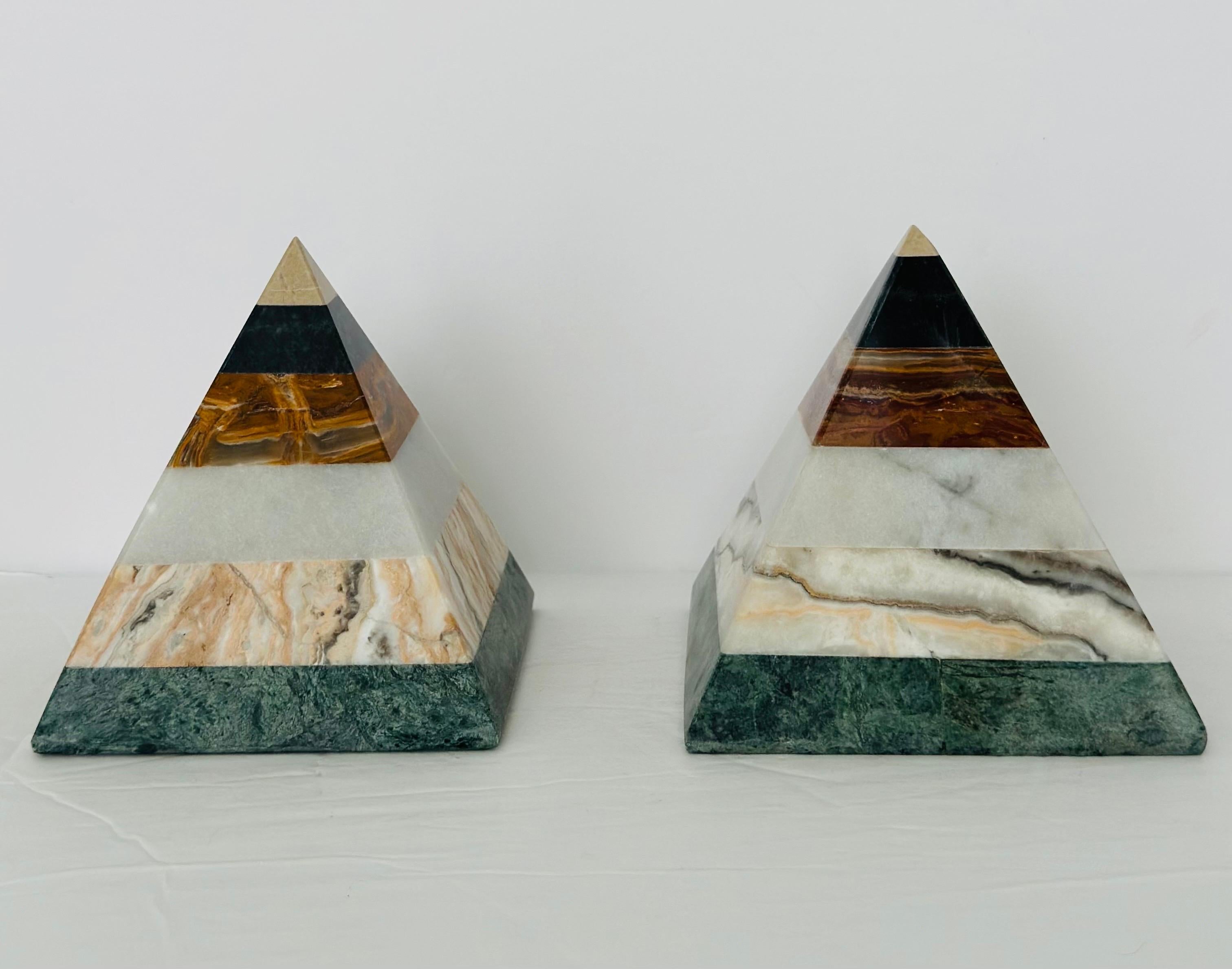 We are very pleased to offer a stunning pyramid sculpture set, circa the 1970s.  Crafted with meticulous attention to detail, each facet is carefully carved and polished to perfection.  These pyramids are not made of traditional materials like stone