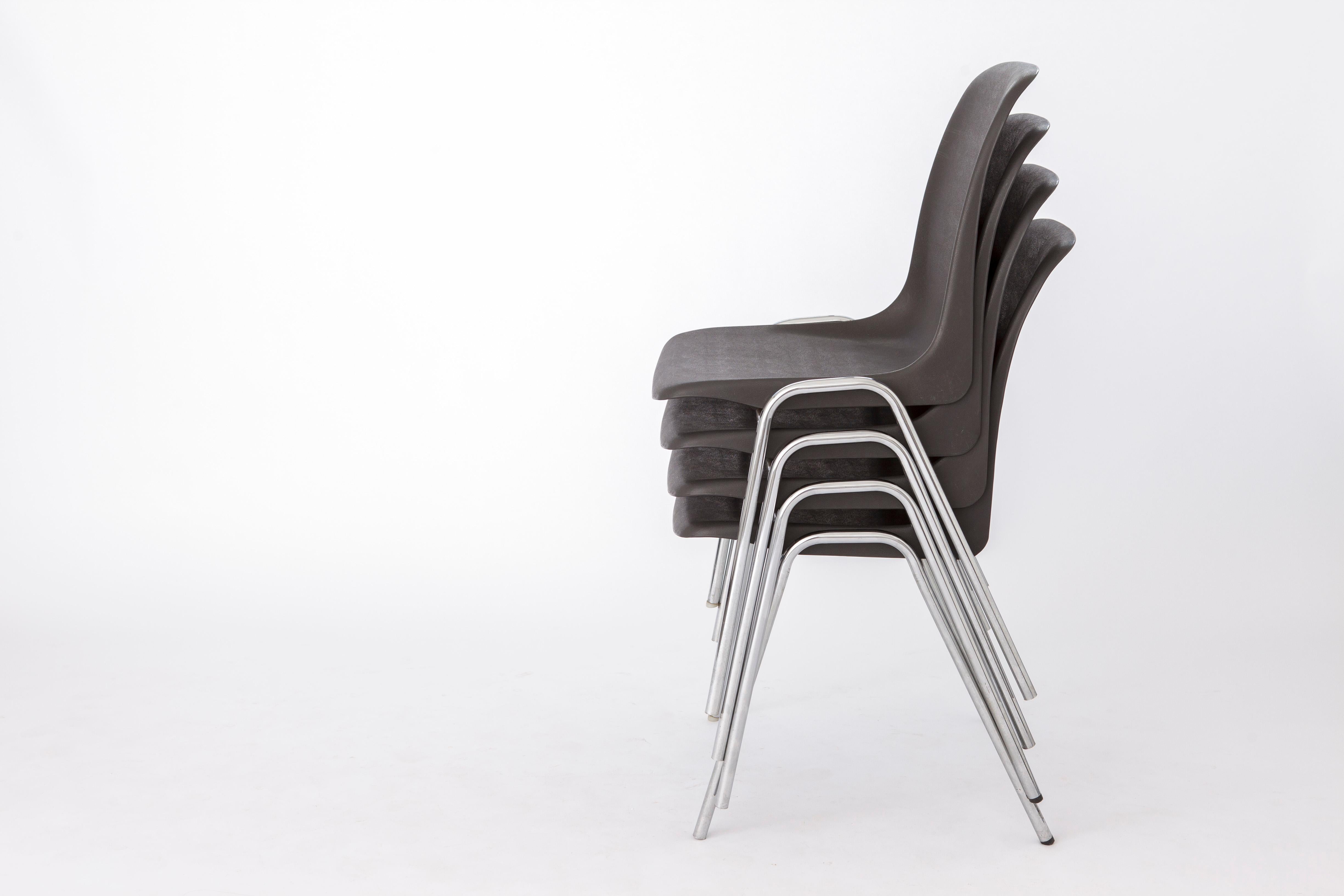 Set of 4 Vintage Plastic chairs. 
Unknown producer. German origin. 
Year of production: 1974. 
Displayed price is for 4 chairs. 

Good condition. Metal chrome feet and plastic seat. 
Stamp with year of production under the seat. 