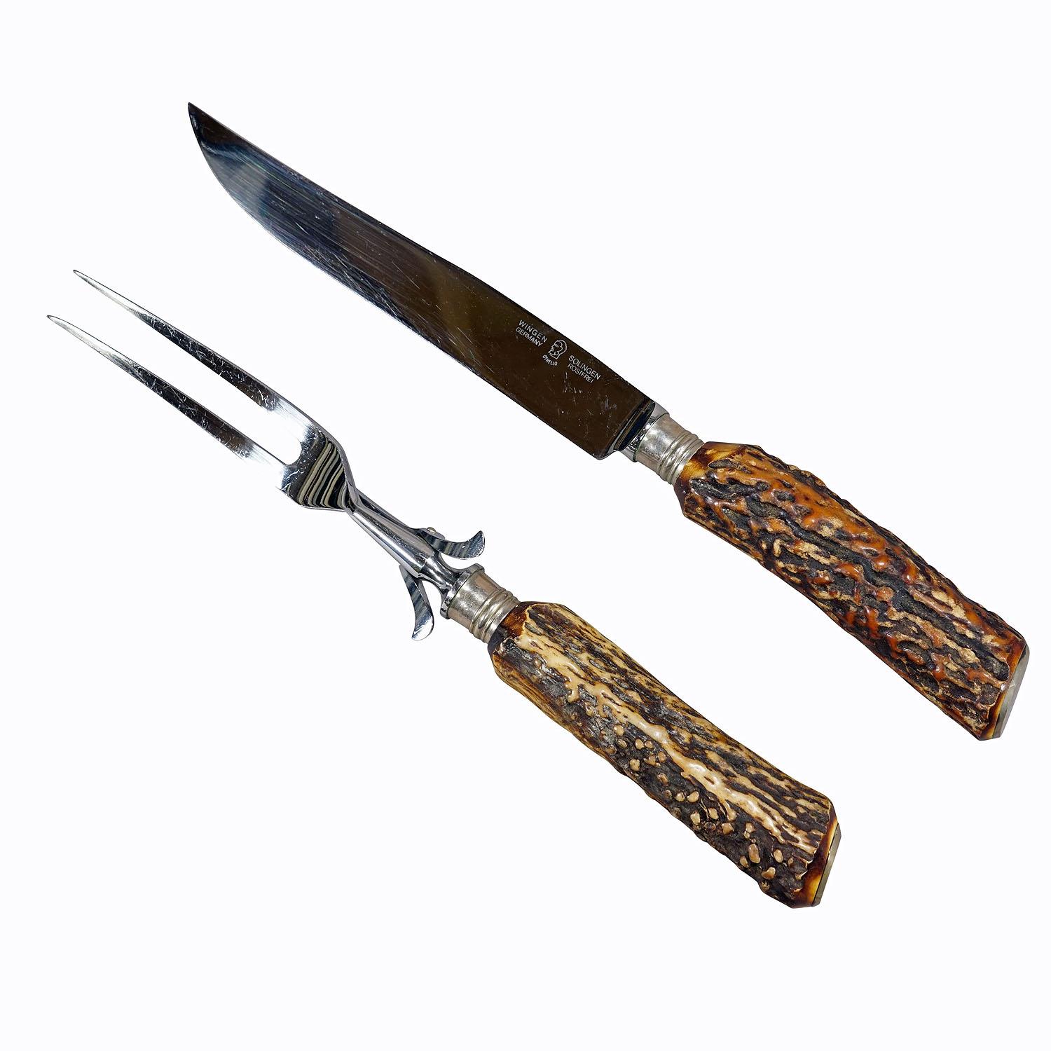Vintage Stag Horn Carving Set by Anton Wingen, Solingen

A rustic carving set consisting of fork and knife. The handles are made of genuine stag horn and feature a silver knob on their ends. Blade and fork made of stainles steel. Manufactured by