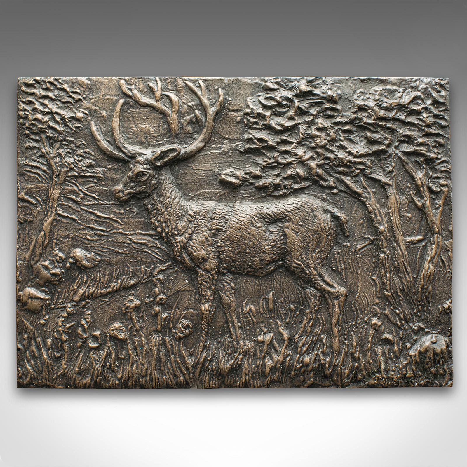This is a vintage stag relief plaque. An English, bronze decorative plate, dating to the mid 20th century, circa 1950.

Delightfully weathered appearance with country house appeal
Displaying a desirable aged patina and in original order
Bronze