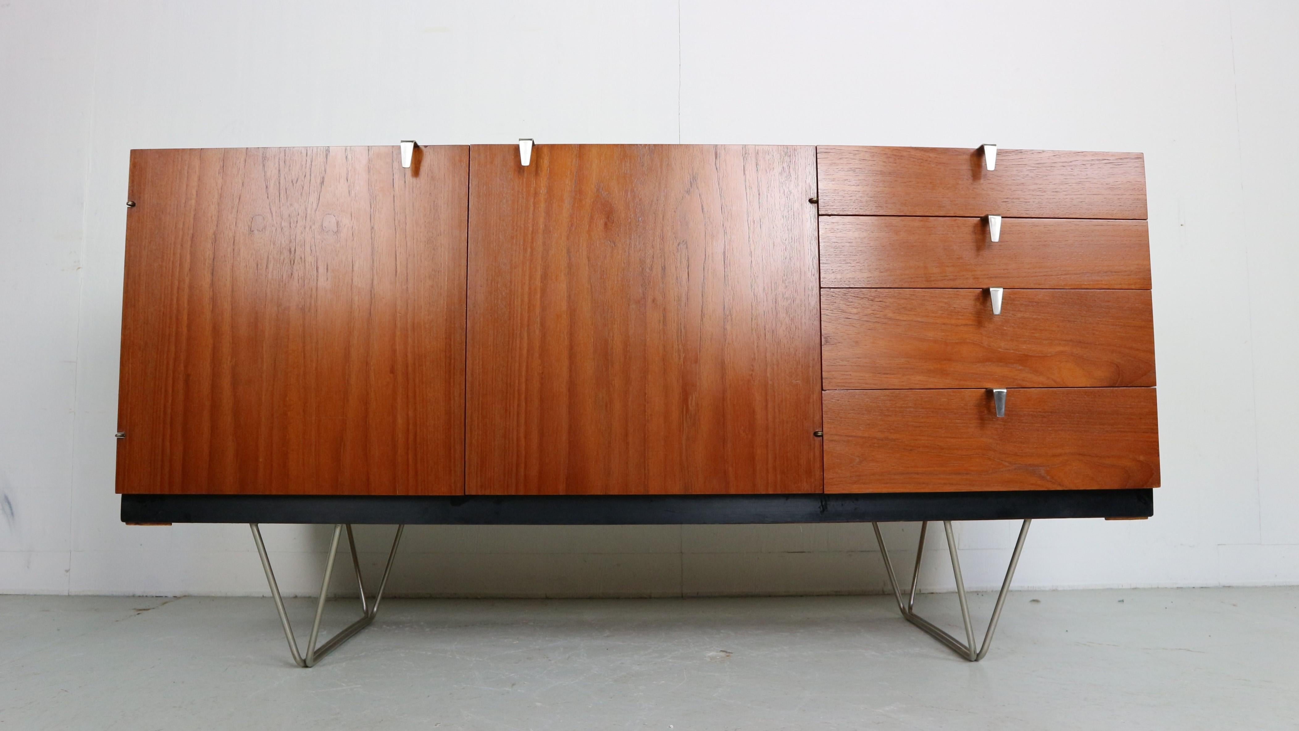 A Classic late 1950s sideboard designed by John and Sylvia Reid, from the ‘S Range’ produced in England by Stag Furniture. Made in teak with polished steel handles and hairpin legs in very good condition.
These cabinets were only produced,