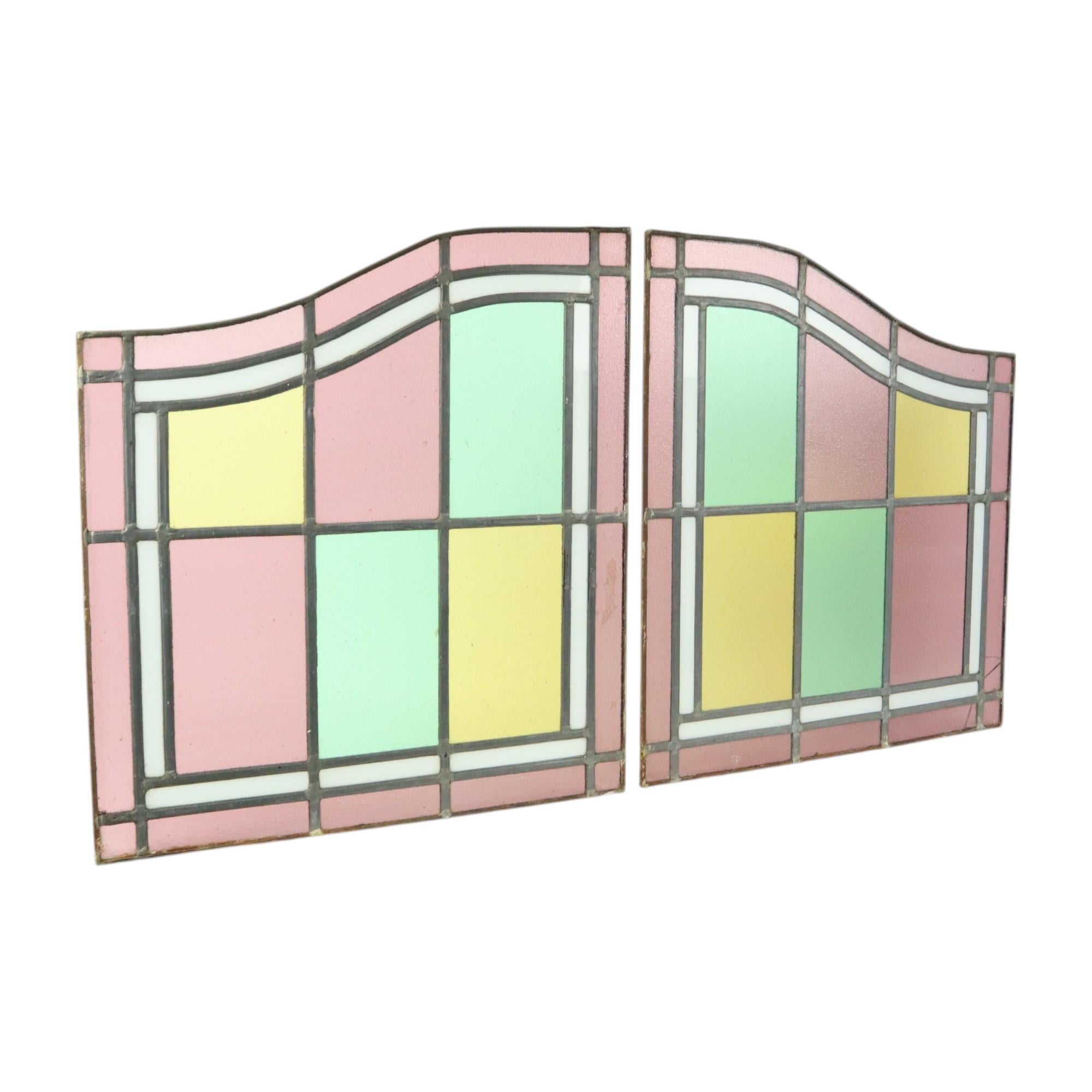 Beautiful set of 2 old stained glass windows, stained glass suncatchers, completely in classical style, first half of the 20th century.

They only really come into their own in front of a window or where the light can shine through!

In very good