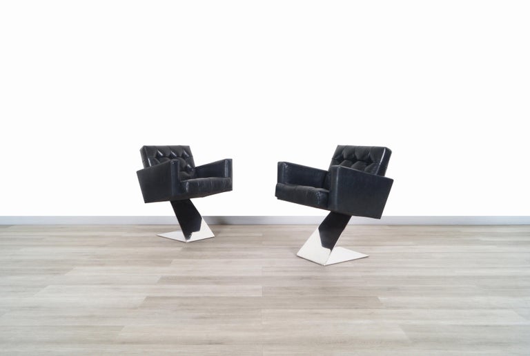 Stunning vintage stainless steel lounge chairs designed by the iconic designer Milo Baughman for Thayer Coggin in the United States, circa 1970s. These chairs have an innovative and daring design, given the year of their creation. The chairs have