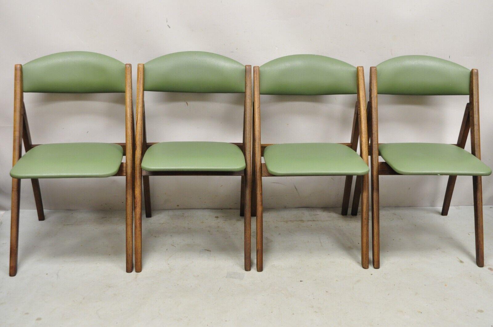 Vintage Stakmore Green Mid-Century Modern Folding Game Chairs - Set of 4. Item features Green vinyl upholstery, solid wood frames, original labels, clean modernist lines, great style and form. Circa Mid-20th century.
Measurements:
Open: 31