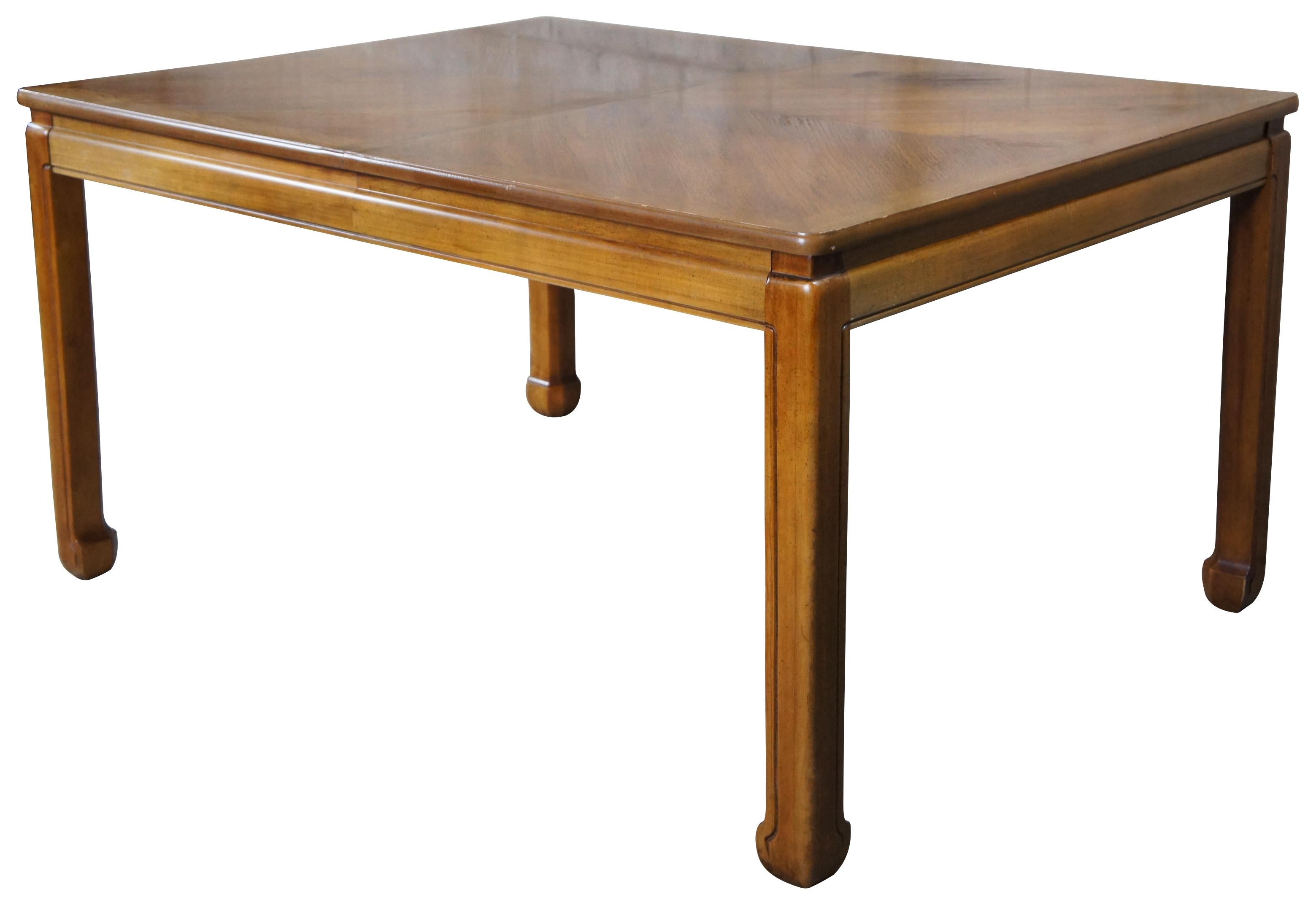 Stanley furniture dining table, circa last quarter 20th century. Features a rectangular form with matchbook oak top and ming inspired feet.

Measures: 42
