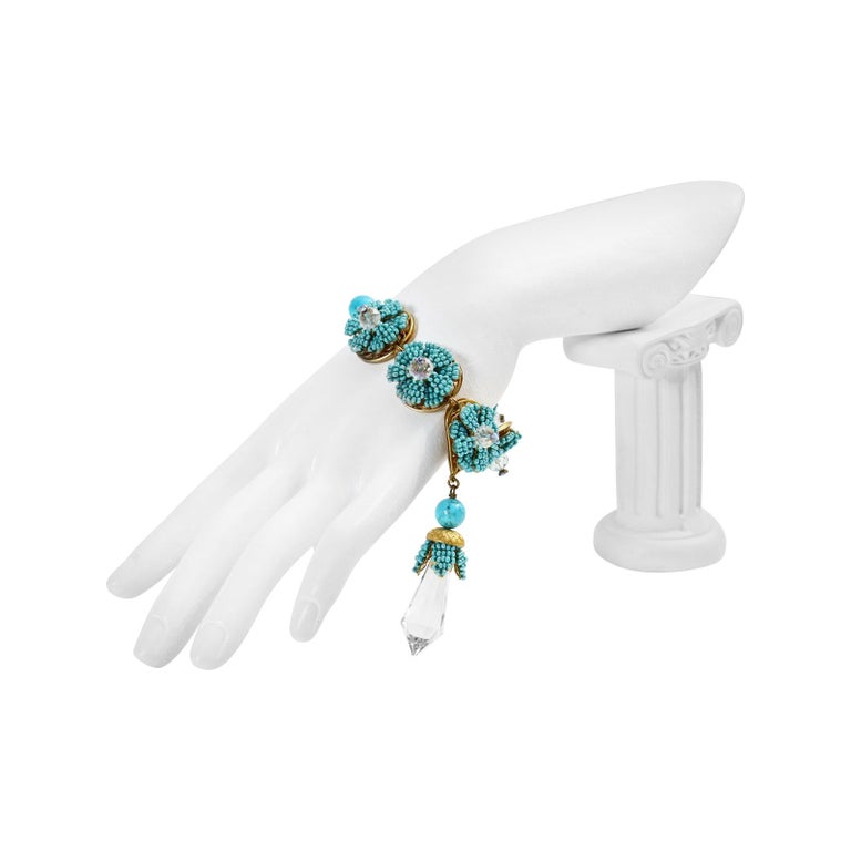 Vintage Stanley Hagler Faux Turquoise and Dangling Crystal Piece Bracelet Circa 1960s. Such a wonderful piece from this era and even lovely mixed with real.  Set on Gold Tone and even the back is set on a gorgeous decorative flower base.  The