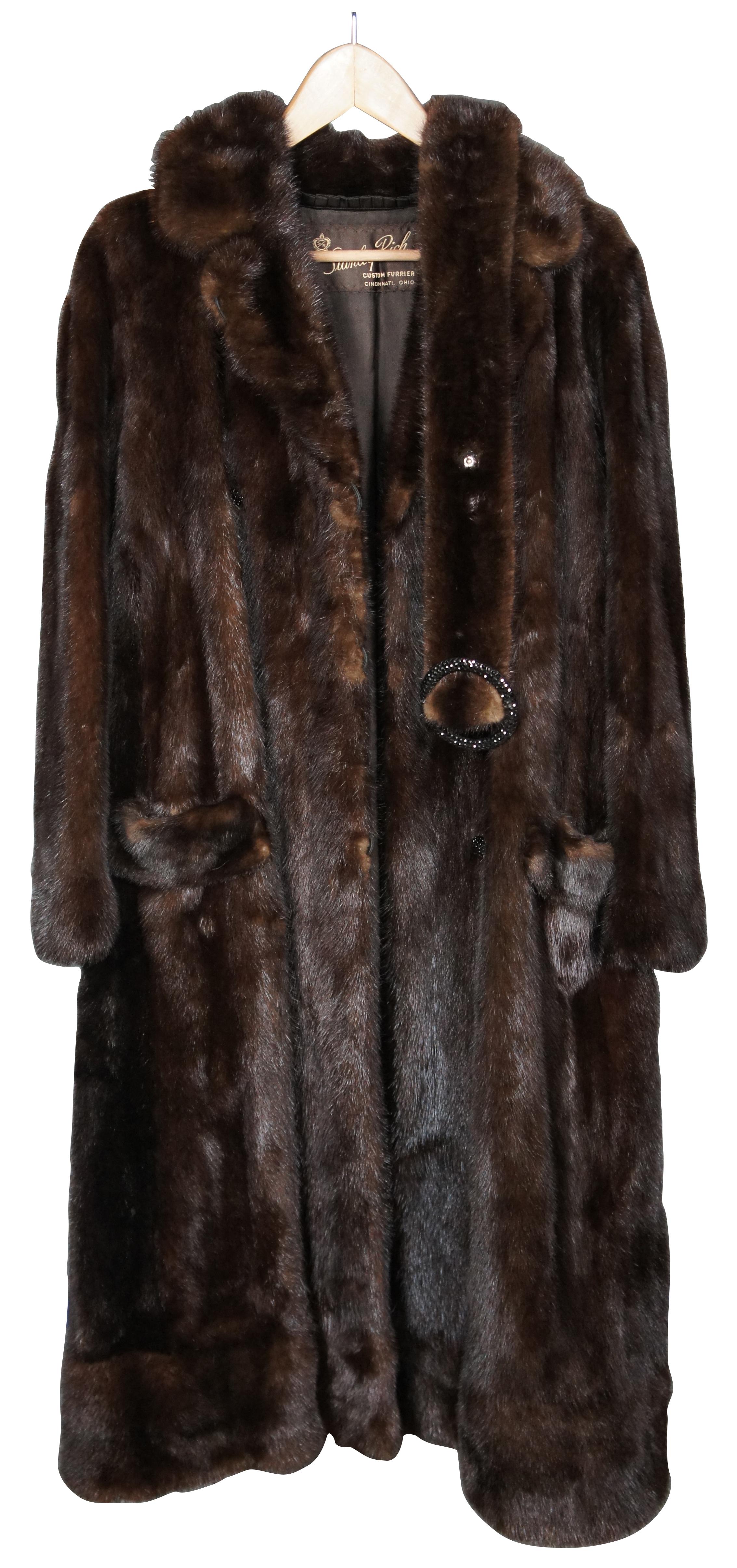 Vintage dark brown mink coat by Stanley Rich of Cincinnati, Ohio, full length with two front pockets, double breasted with two rows of black rhinestone studded buttons, and belt with matching ring buckle. Floral embroidered lining with single