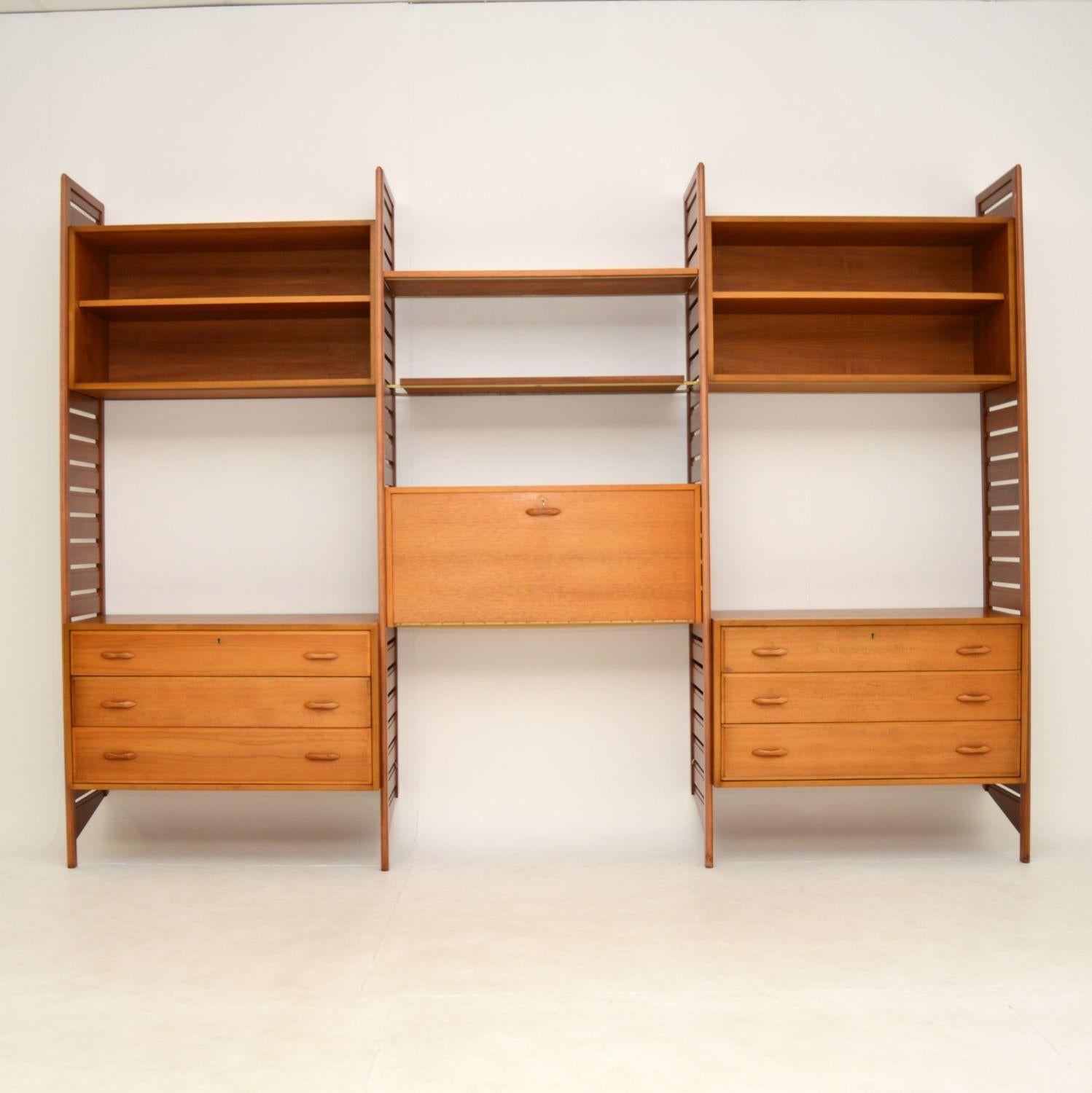 A wonderful Ladderax shelving system by Staples, this was made in England and dates from the 1960’s.

This set includes four tall ladder rails, two large chest of drawers, two open cabinets with adjustable shelves, a drop down writing bureau with