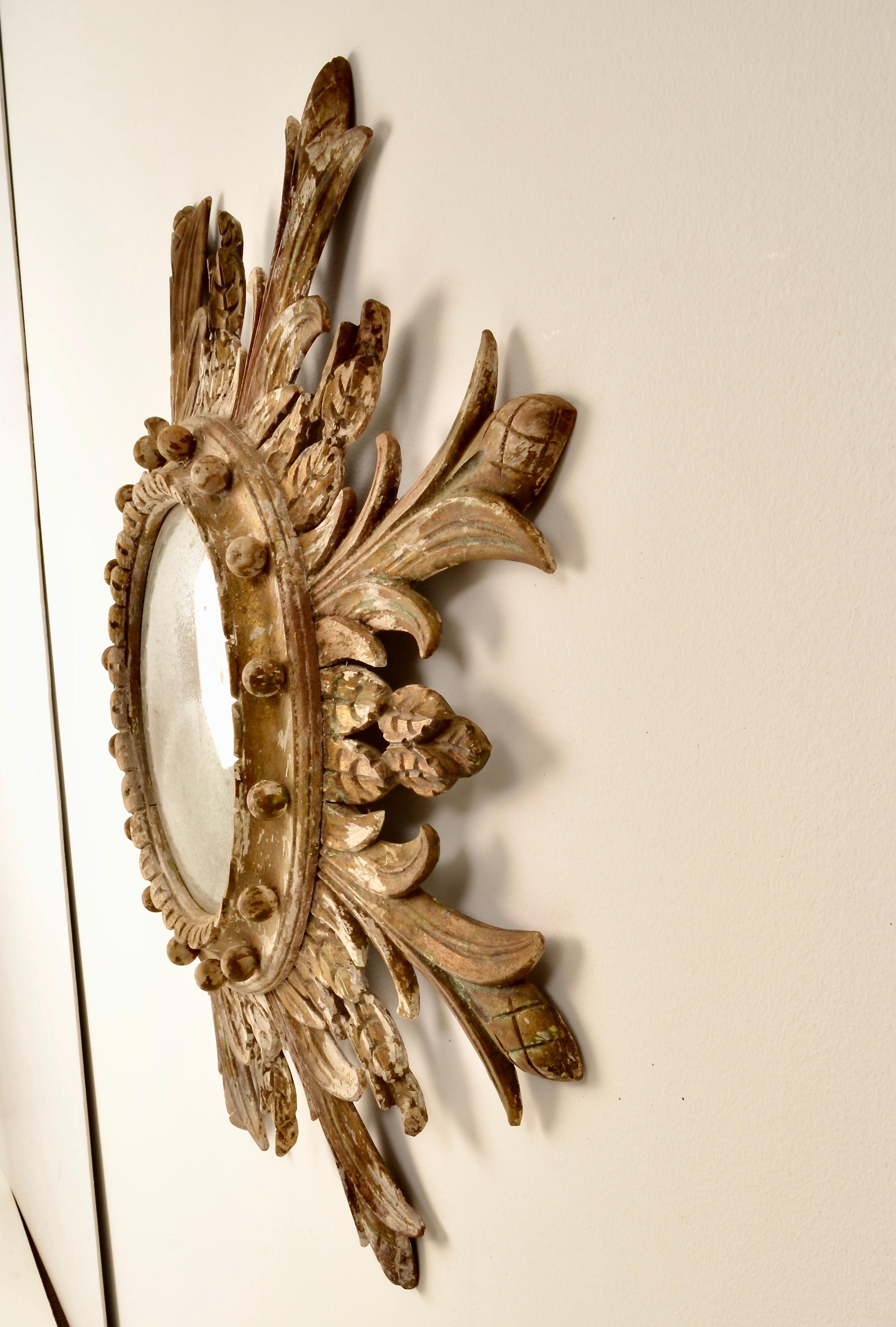 Hand carved wood mirror with attractive distressed finish and center bull's eye mirror. Continental style. Great size.