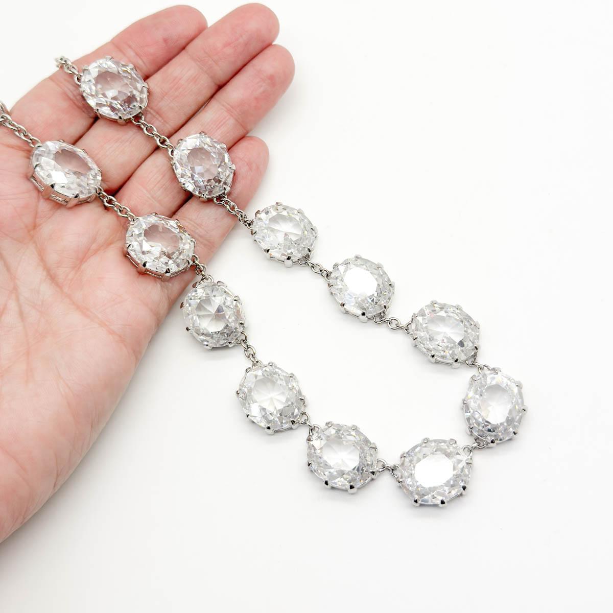 A statement Vintage Crystal Riviere Necklace from the 2000s yet inspired by centuries old design from the Georgian era.
Rivière refers to a river of gems around the wearers neck. Both romantic and lavish. The Rivière necklace first became popular