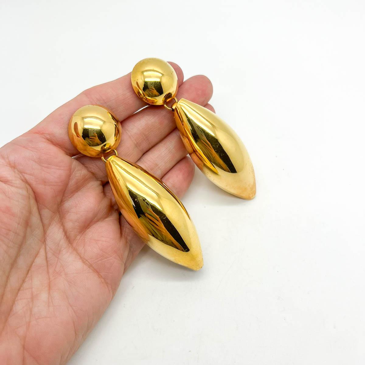 A striking and totally timeless pair of Vintage Statement Bomb Earrings. Crafted in lustrous gold plate their architectural design remains one hundred percent a style statement.

An unsigned beauty. A rare treasure. Just because a jewel doesn’t