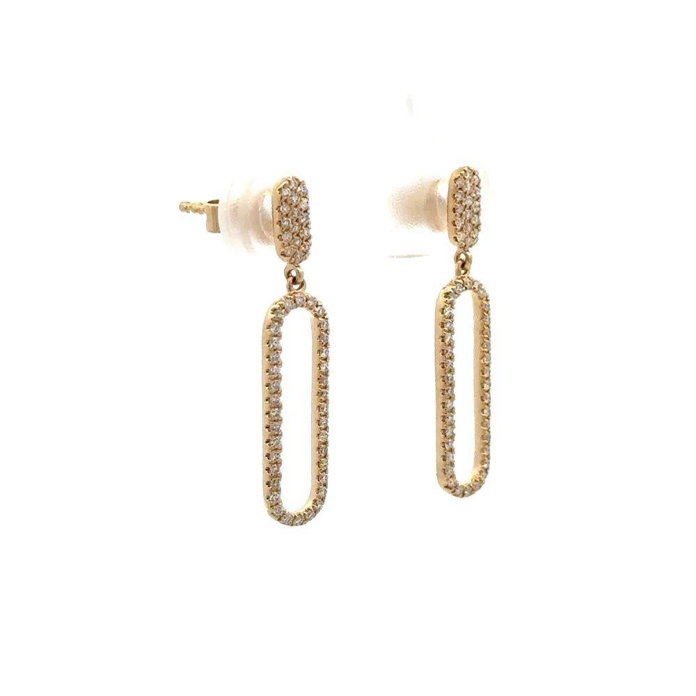 Simply Beautiful! Vintage Oscar worthy elongated Open Paperclip Design Diamond Gold Hoop Runway Drop Earrings. Hand crafted in 14K Yellow Gold. Pave Hand set with Sparkling Round Brilliant Cut Diamonds, weighing approx. 0.28tcw. Earrings measure