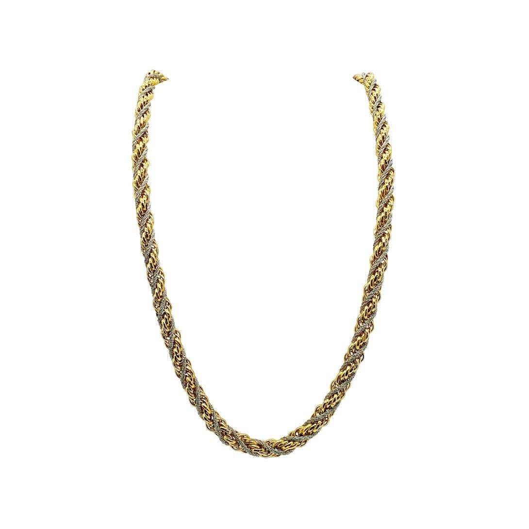 A large and chunky Vintage two tone rope chain. Featuring a rope twist comprising gold and silver tone metals for a statement look finished with bell top ends.

Vintage Condition: Very good without damage or noteworthy wear. 
Materials: Gold Plated