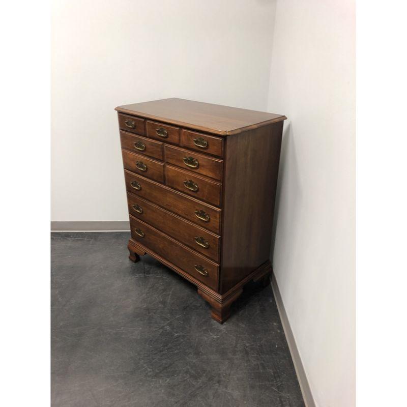 A Chippendale style chest of drawers by Statton Furniture. Solid cherry wood with brass hardware, clipped corners & bevel edge to the top, and ogee bracket feet. Features five drawers of dovetail construction, top two having faux fronts and interior
