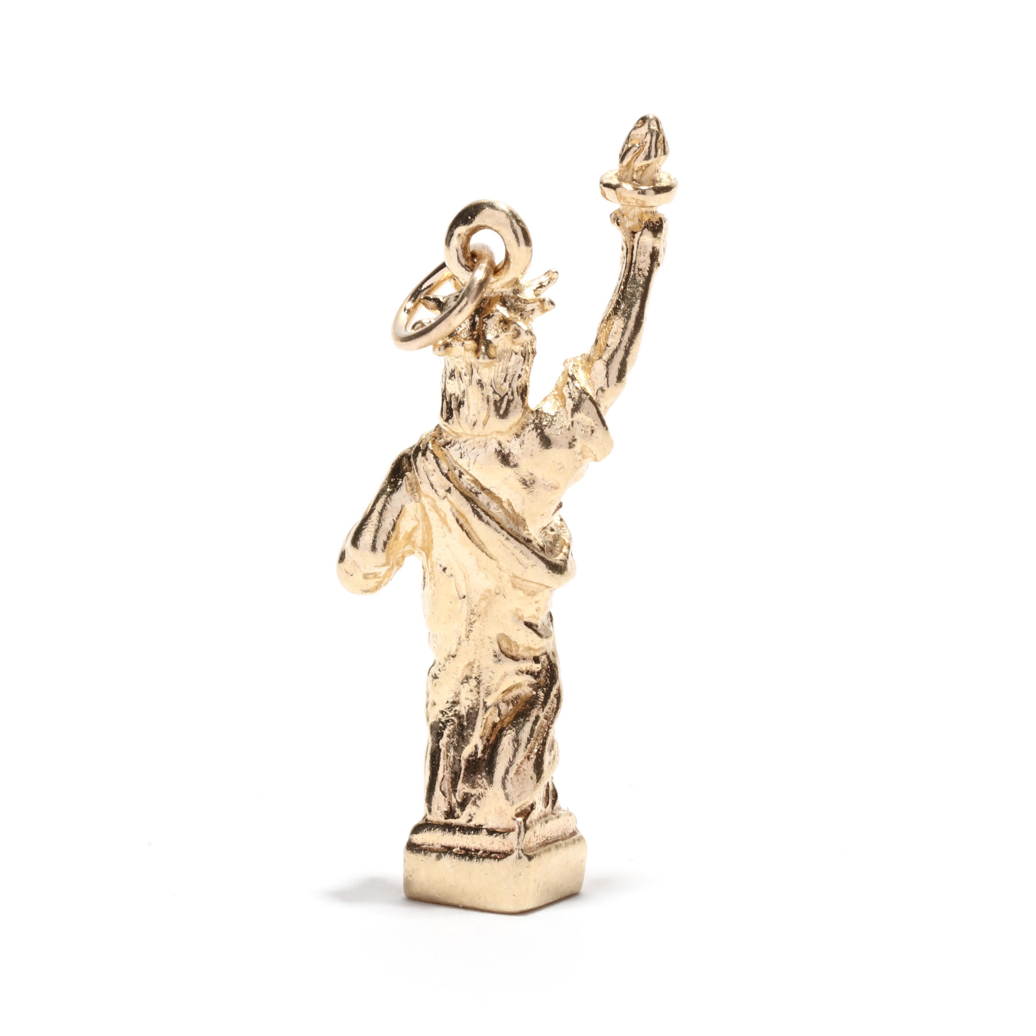 A vintage 14 karat yellow gold Statue of Liberty charm. This heavy charm features a carved Lady Liberty stature with a thin bail.

Length: 1 1/8 in.

Width: 1/2 in.

Weight: 3 dwts.



Ring Sizings & Modifications:
* We are happy to assist in any