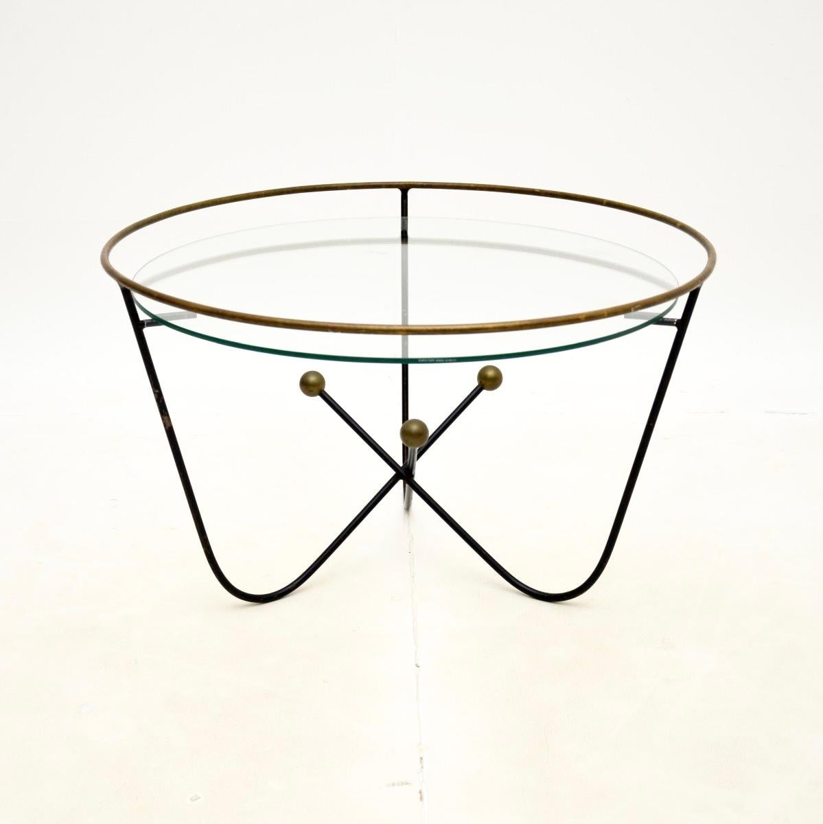 A stylish and iconic vintage steel and brass coffee table by Edward Ihnatowicz. This was made by Mars furniture and was retailed by Heal’s in the 1950’s.

It has an amazing atomic inspired design, it is of superb quality and is a very useful size.