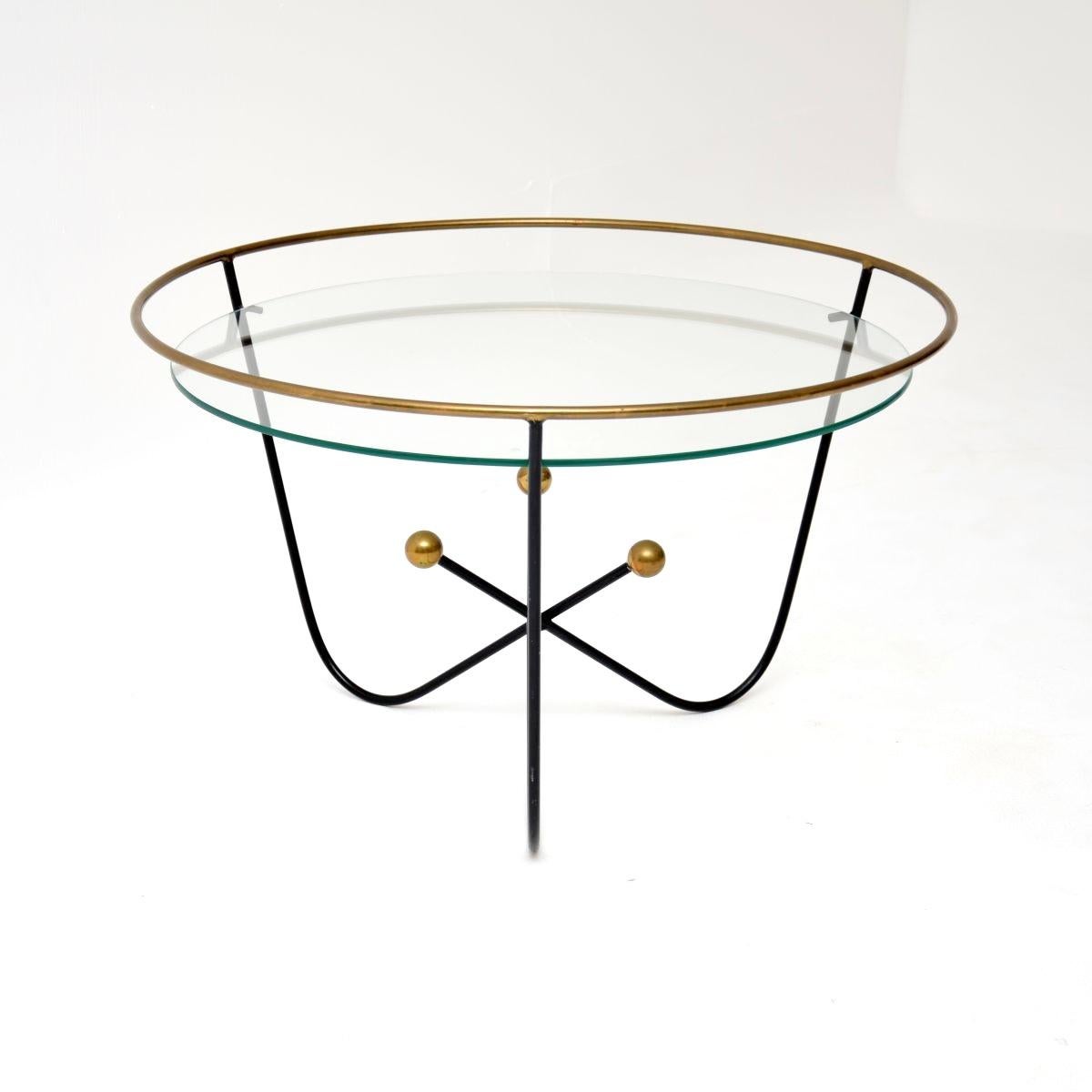 A stylish and iconic vintage steel and brass coffee table by Edward Ihnatowicz. This was made by Mars furniture and was retailed by Heal’s in the 1950’s.

It has an amazing atomic inspired design, it is of superb quality and is a very useful size.