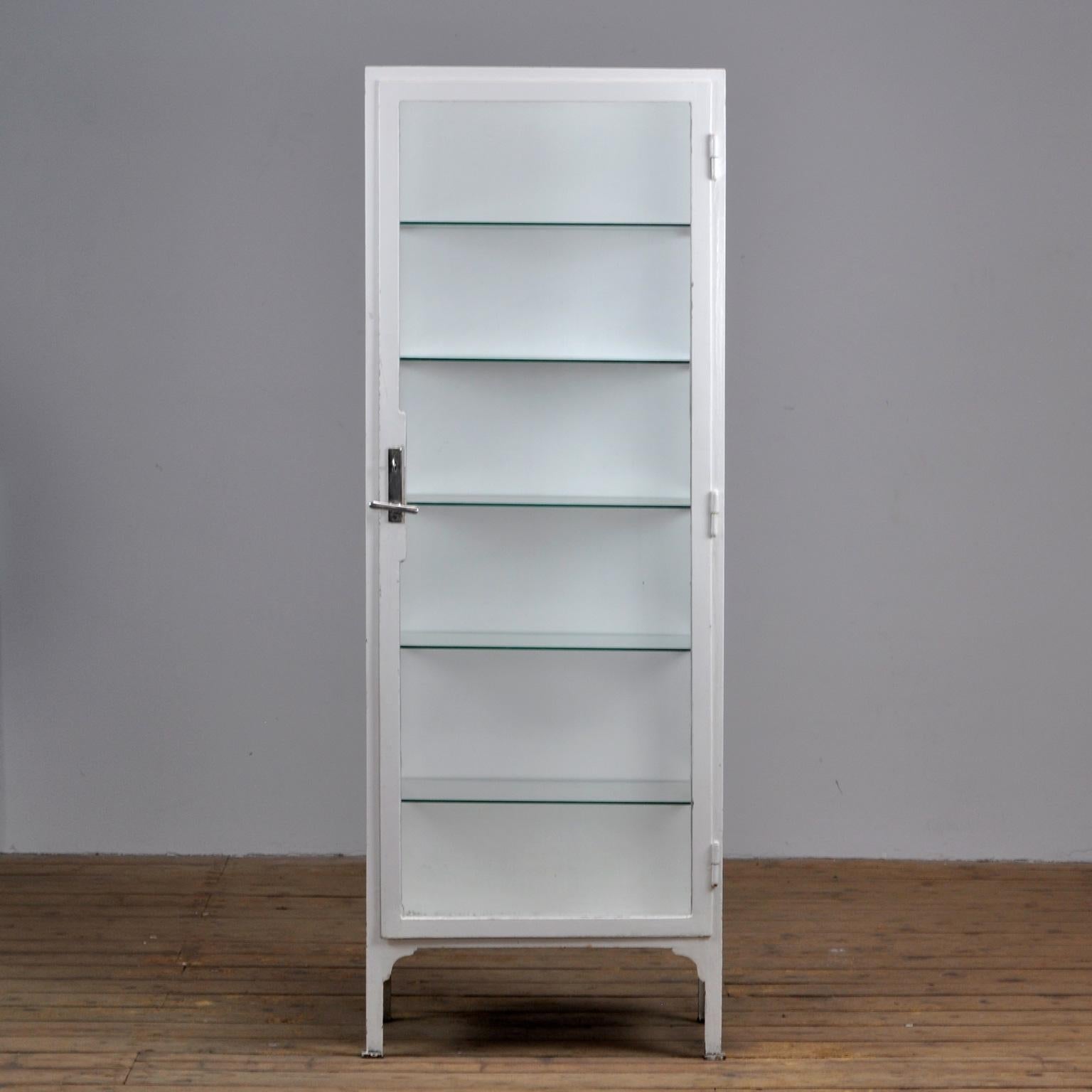 This medicine cabinet was produced in the 1940s in Hungary. The cabinet is made from thick steel and glass. It features five (new) glass shelves.
Nice original lock with handle.