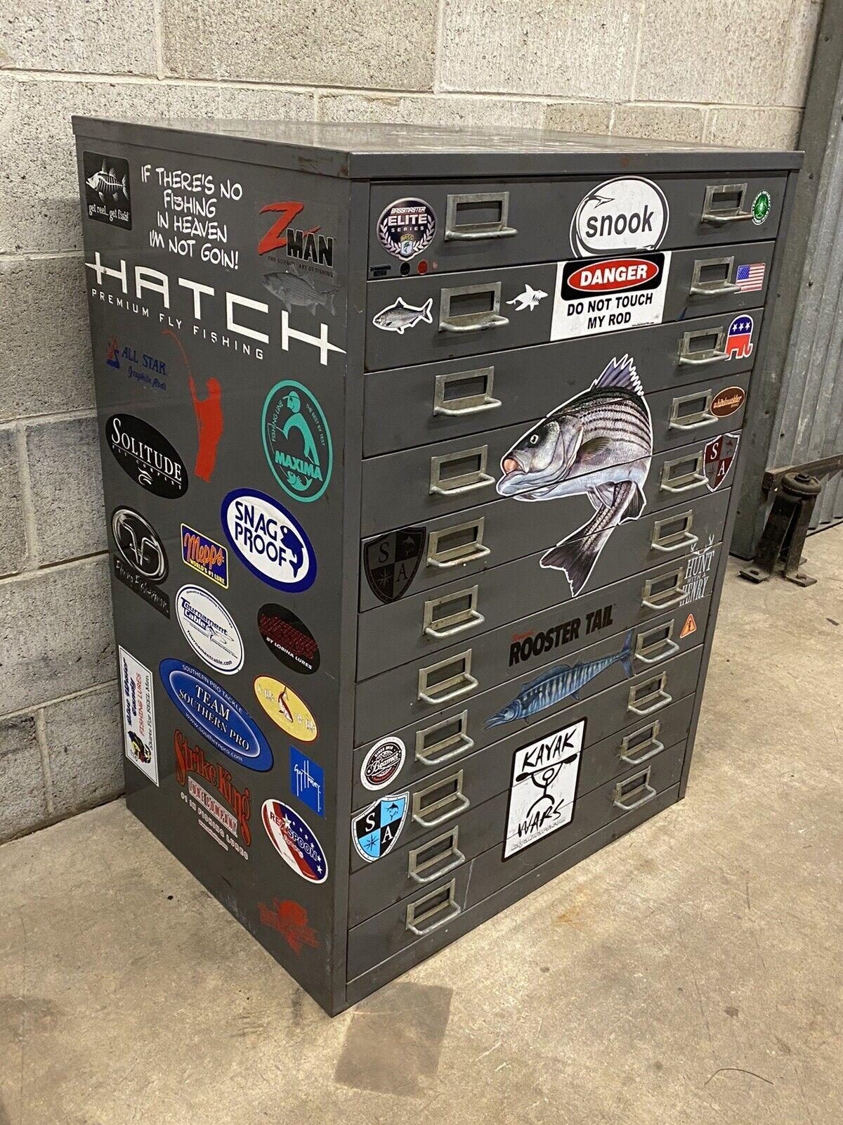 Vintage Steel Metal 11 Drawer Garage Fish Tackle Box Tool Chest Parts Storage Cabinet Item features various stickers throughout. Was used by an avid fisherman/outdoorsman over the years. Circa Late 20th Century. Measurements: 37.5