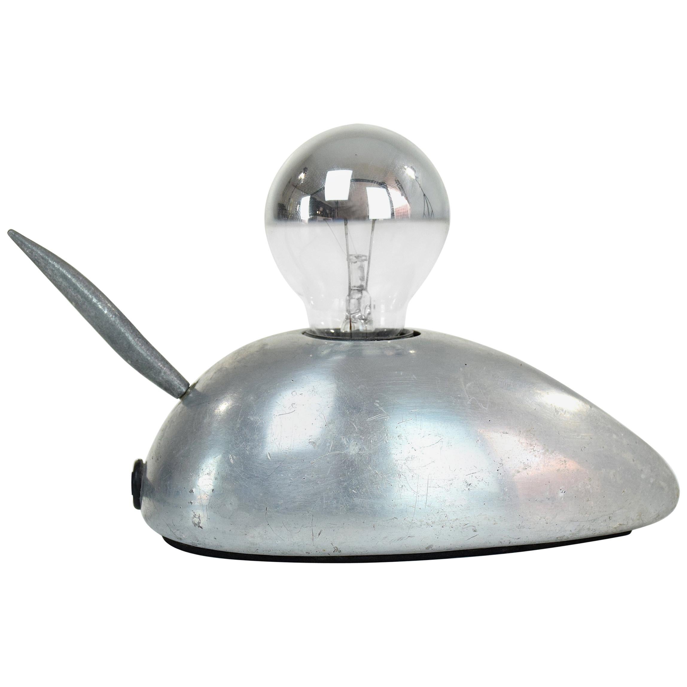 An original 20th century vintage design miniature table lamp in the shape of a mouse composed out of steel with the tail acting as a light switch. Could be considered as an accent decorative object, a reading lamp or night light. Circa