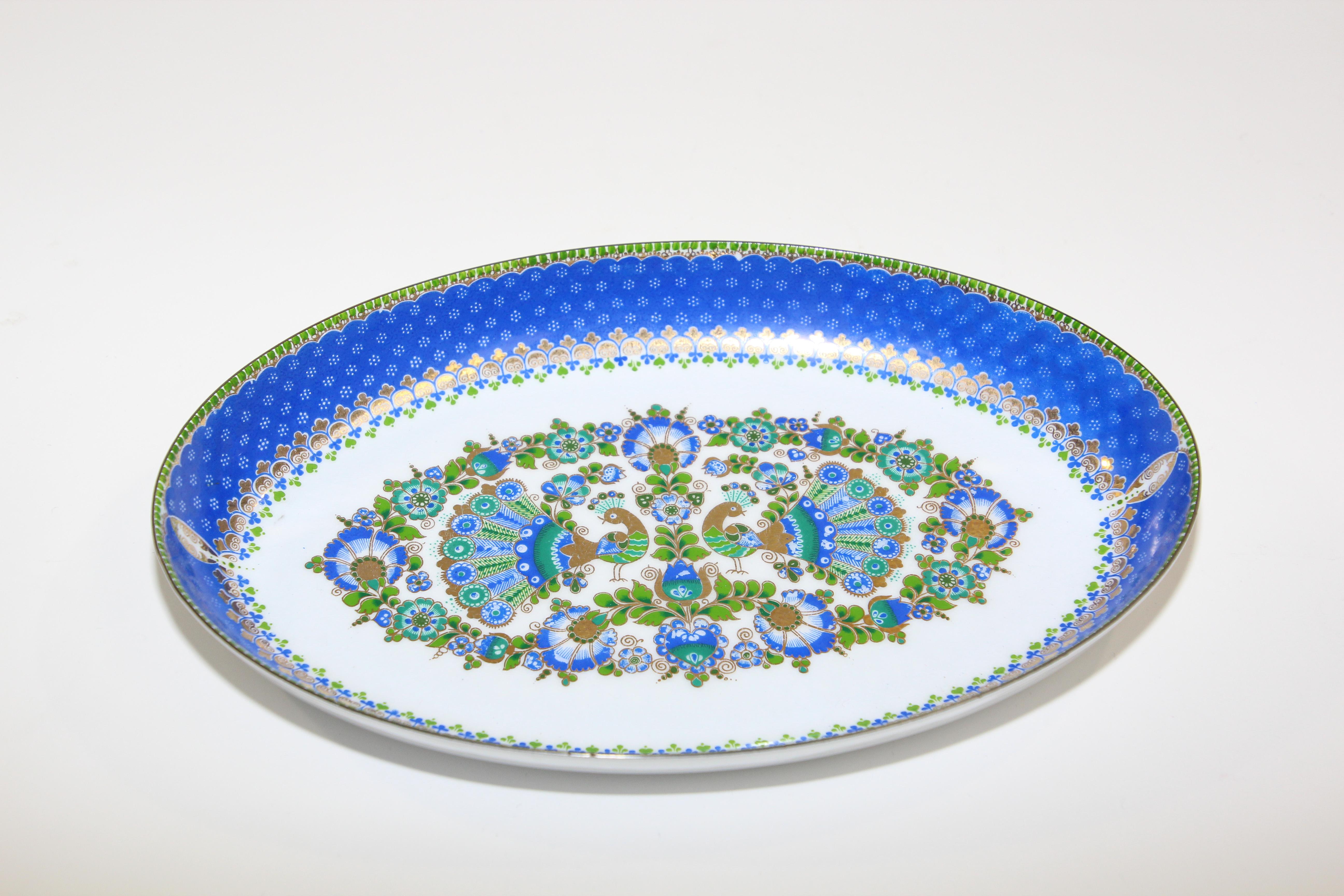 Studio Steinbock Austria enamelware small oval dish, vide poche, appetizer platter.
Beautiful handcrafted enameled oval metal bowl decorated with vivid shades of blue, green and gold, hand painted with precision detail and color with floral and two