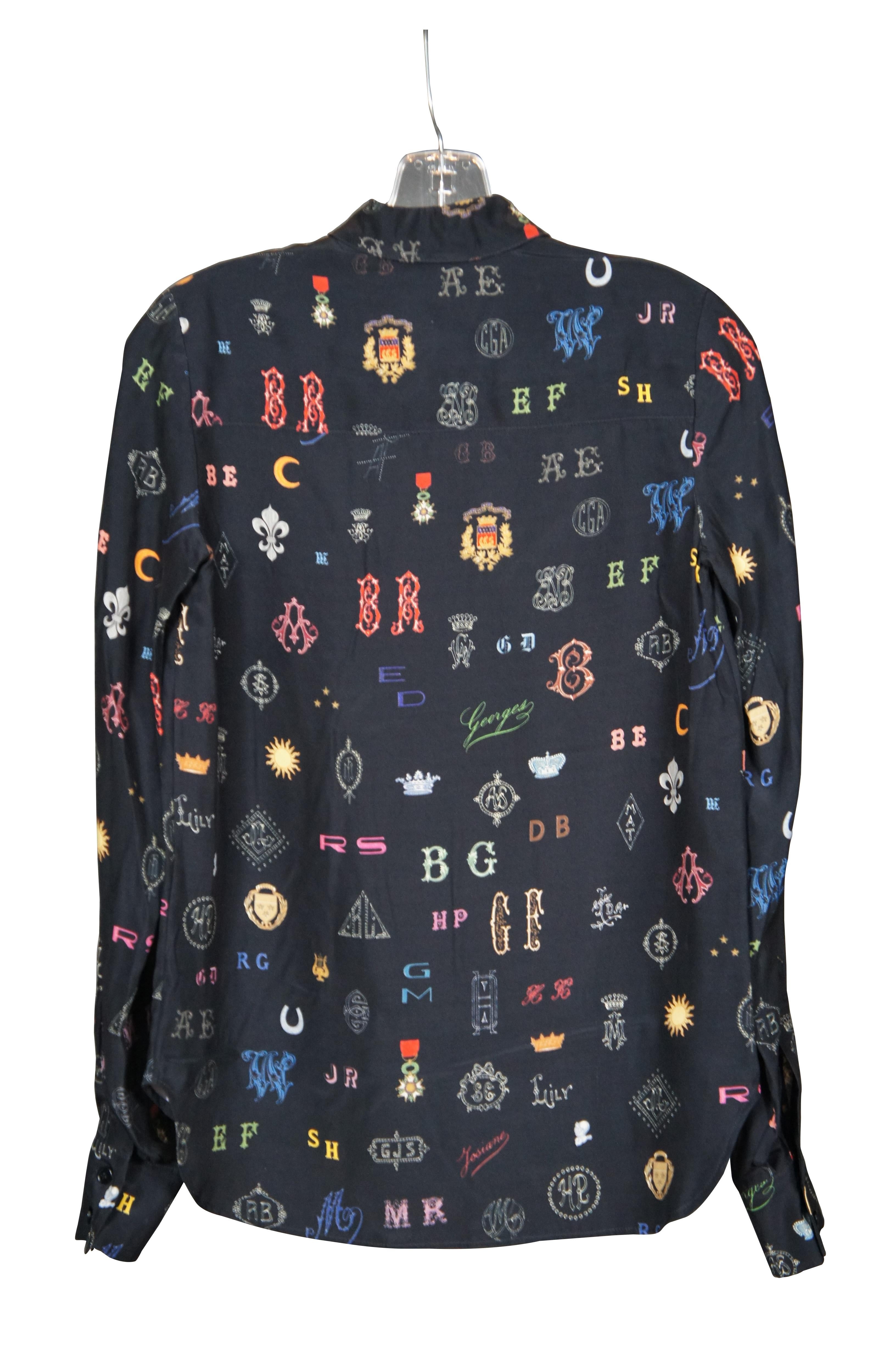 Vintage Stella McCartney 100% silk button up monogram logo shirt / long sleeve blouse with printed pattern on black ground and hem slightly longer in the back then the front. Made in Hungary.

Size 2 / Shoulders – 16” / Arm Length – 24.5” / Chest
