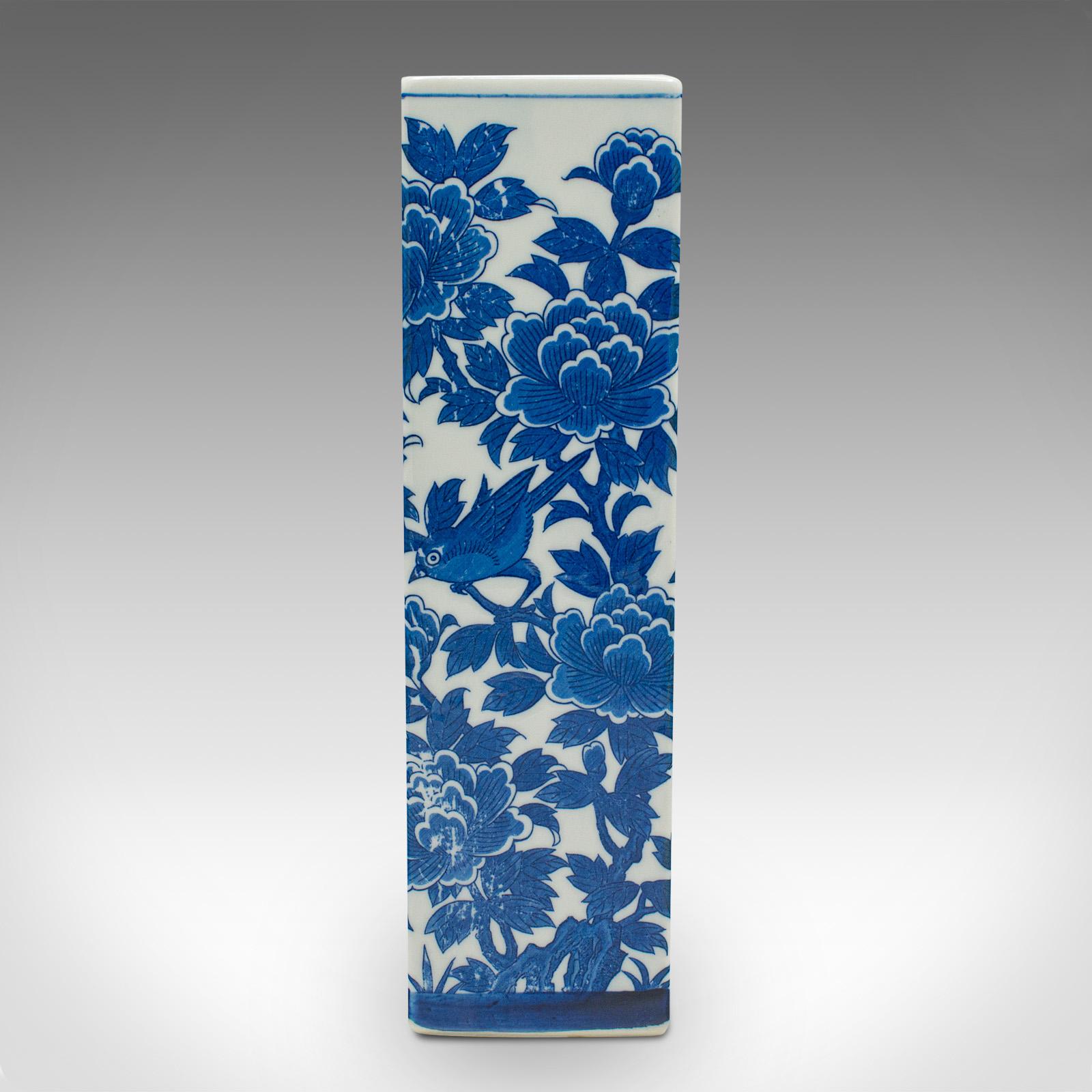 This is a vintage stem vase. A Chinese, ceramic flower sleeve with blue and white decoration, dating to the late 20th century, circa 1970.

Appealing square form with a bold decorative pattern
Displays a desirable aged patina and in good order
Crisp