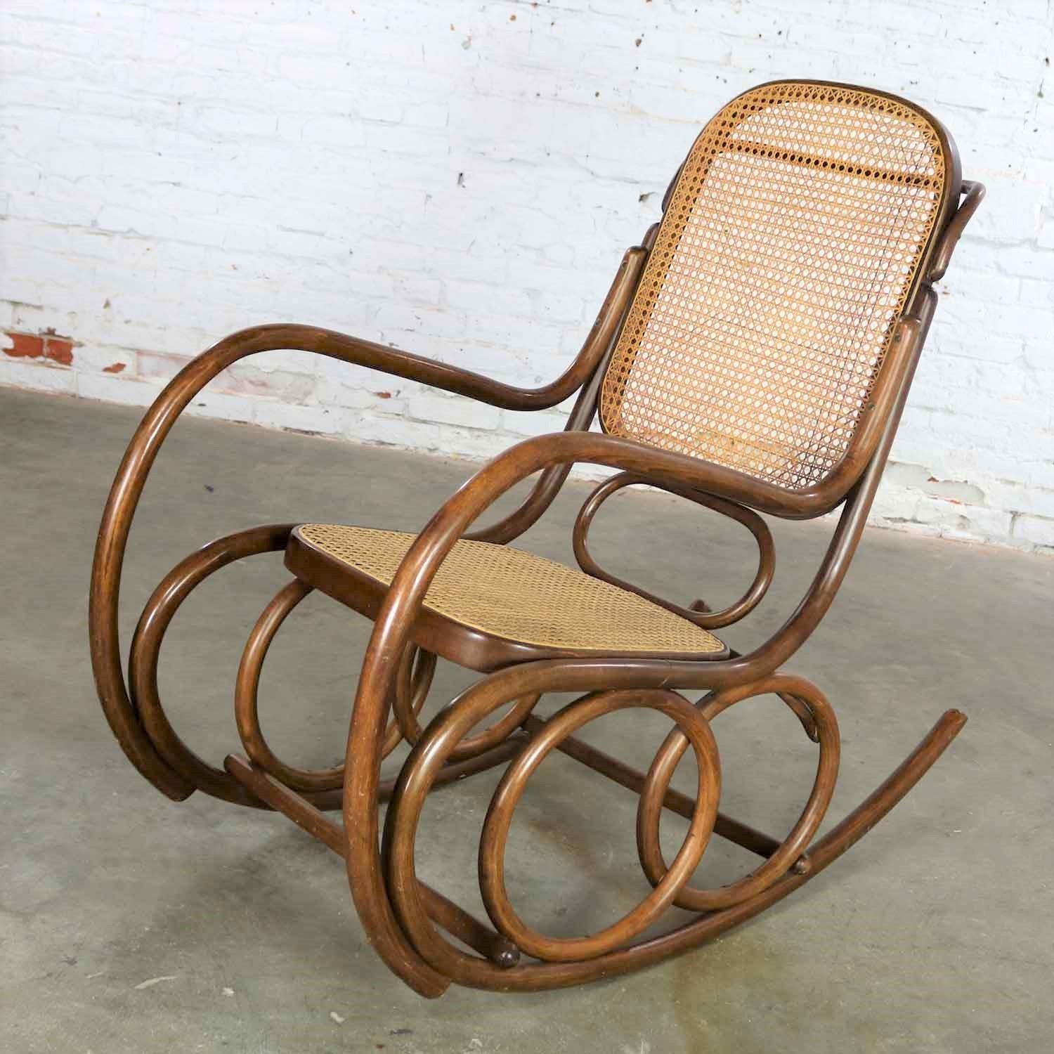Handsome bentwood and cane double circle design rocker with handle by Thonet for Stendig. It retains its original oval Stendig handmade in Czechoslovakia sticker as well as an ink stamp. It is in wonderful vintage condition with no outstanding flaws