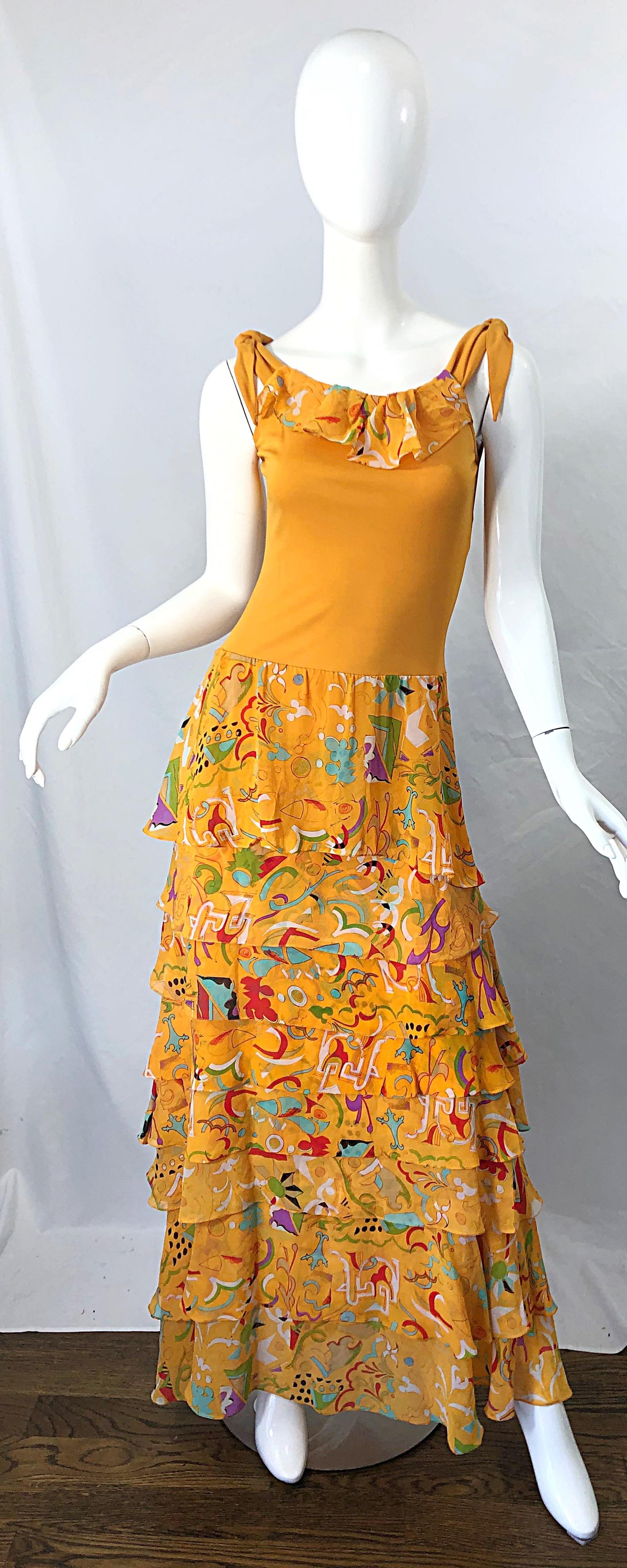 Beautiful and rare vintage STEPHEN BURROWS matte silk jersey and chiffon orange / marigold maxi dress ! Features a jersey bodice with a tiered ruffled skirt. Abstract print in blues, greens, turquoise blue, red, etc. throughout. Simply slips over