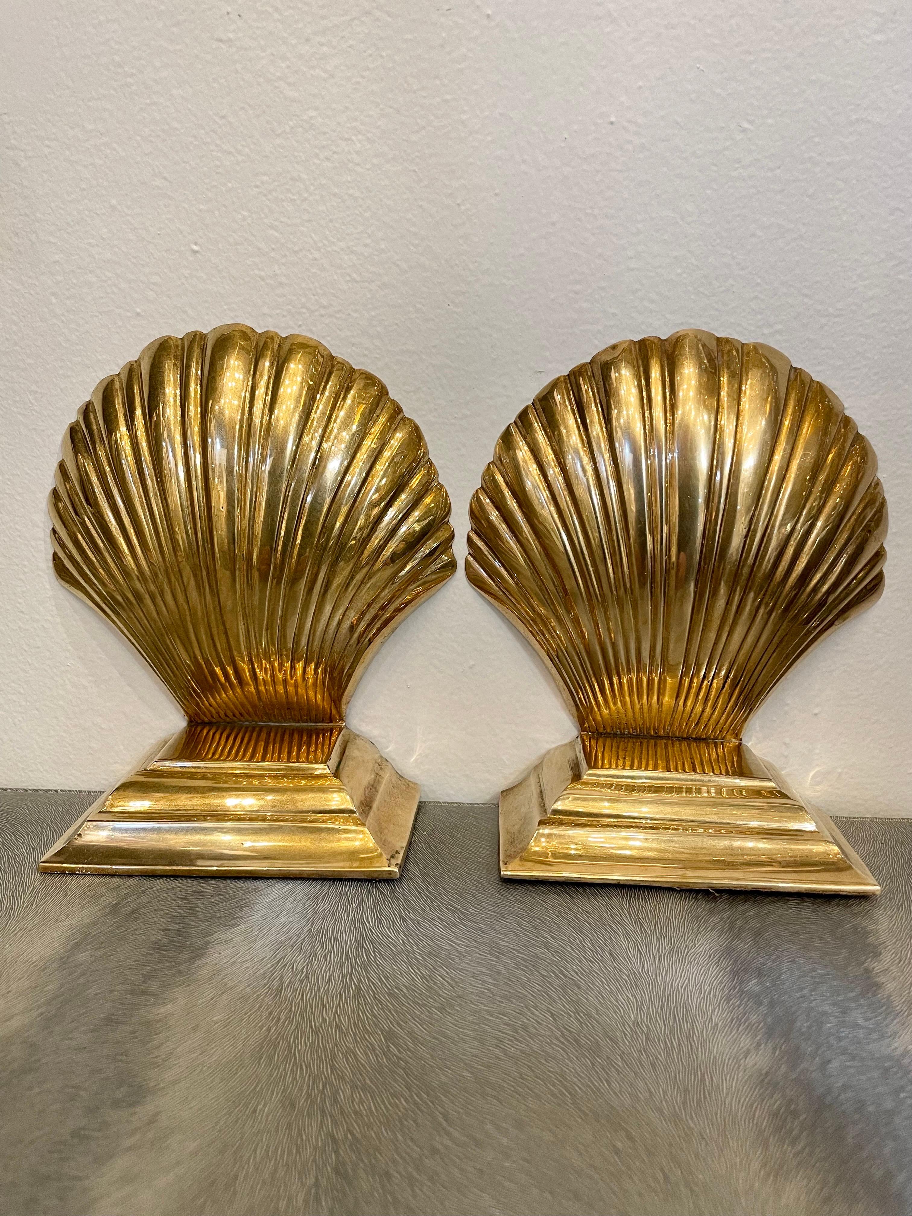 Vintage stepped brass clam shell seashell bookends. Larger size. Good condition. Has nice size to hold a stack of books. Great for your beach house! Any dark areas are reflection only.