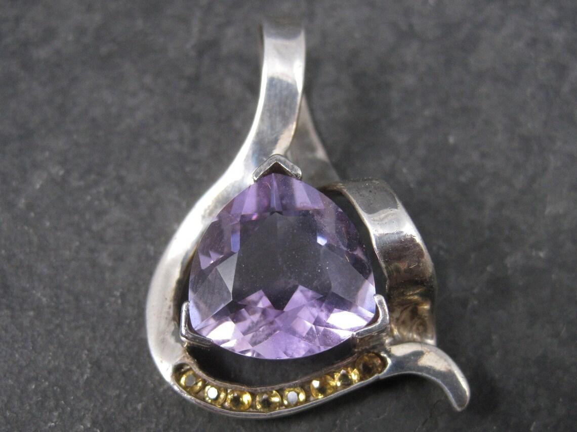 This piece is much more amazing in person than my photos portray.
The amethyst measures 16x16mm - thats 5/8 of an inch!
It is accented by 8 bright yellow round citrines.
The pendant measures 1 3/8 by 7/8 inches.
It is sterling silver.
Hallmarks: