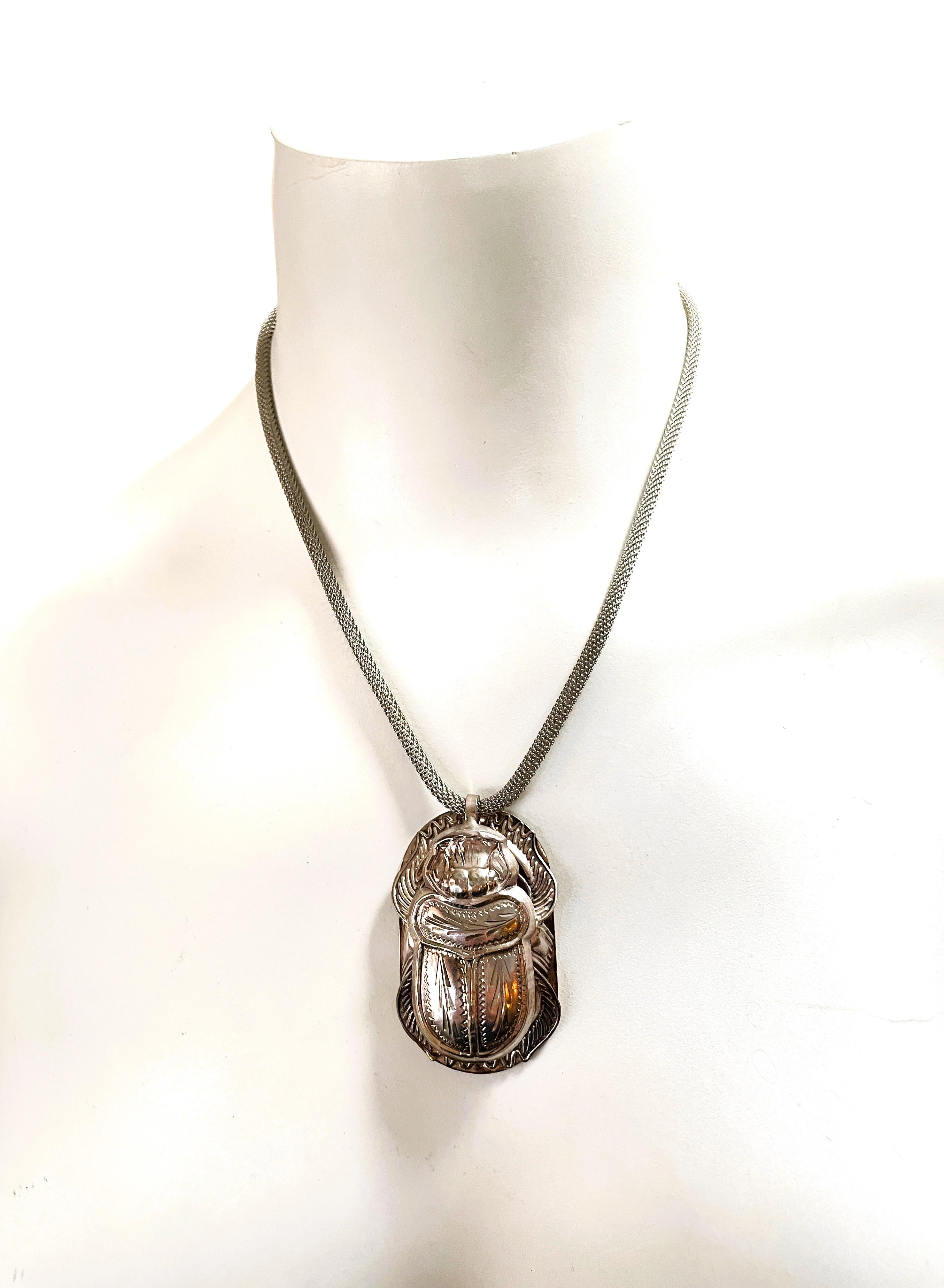 This is a very unique necklace and earring set.  The pendant is 2 inches long and 1.25 inches wide.  You have your choice of chains.  I have both photographed.  One is a sterling link chain that measures 17.25 inches and has a hook and eye closure. 