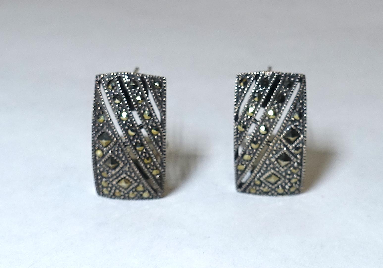These vintage marcasite earrings have a simple but elegant design in sterling silver.  These pierced earrings measure 7/8” x 1/2” and are in excellent condition.