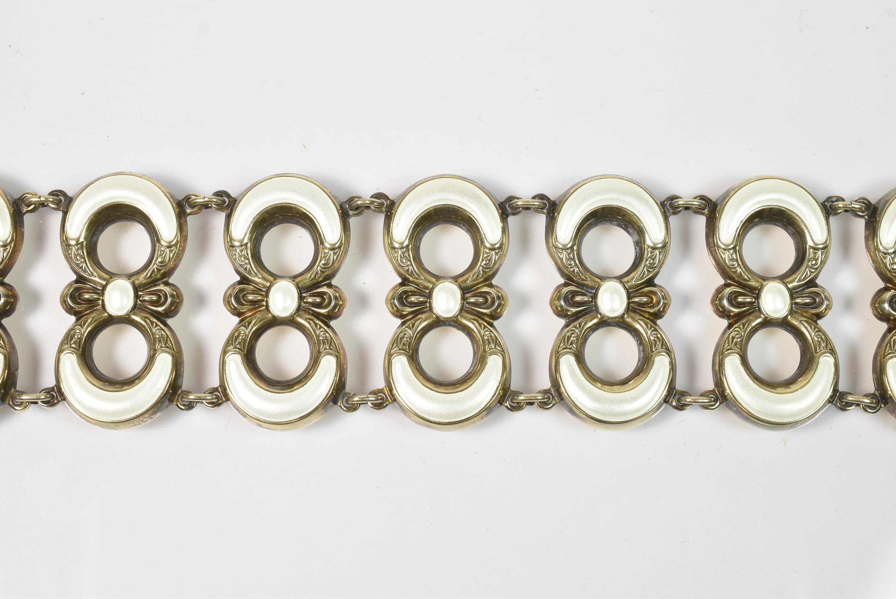Vintage gilded sterling silver and white or pearl tone enamel figure eight links bracelet with 