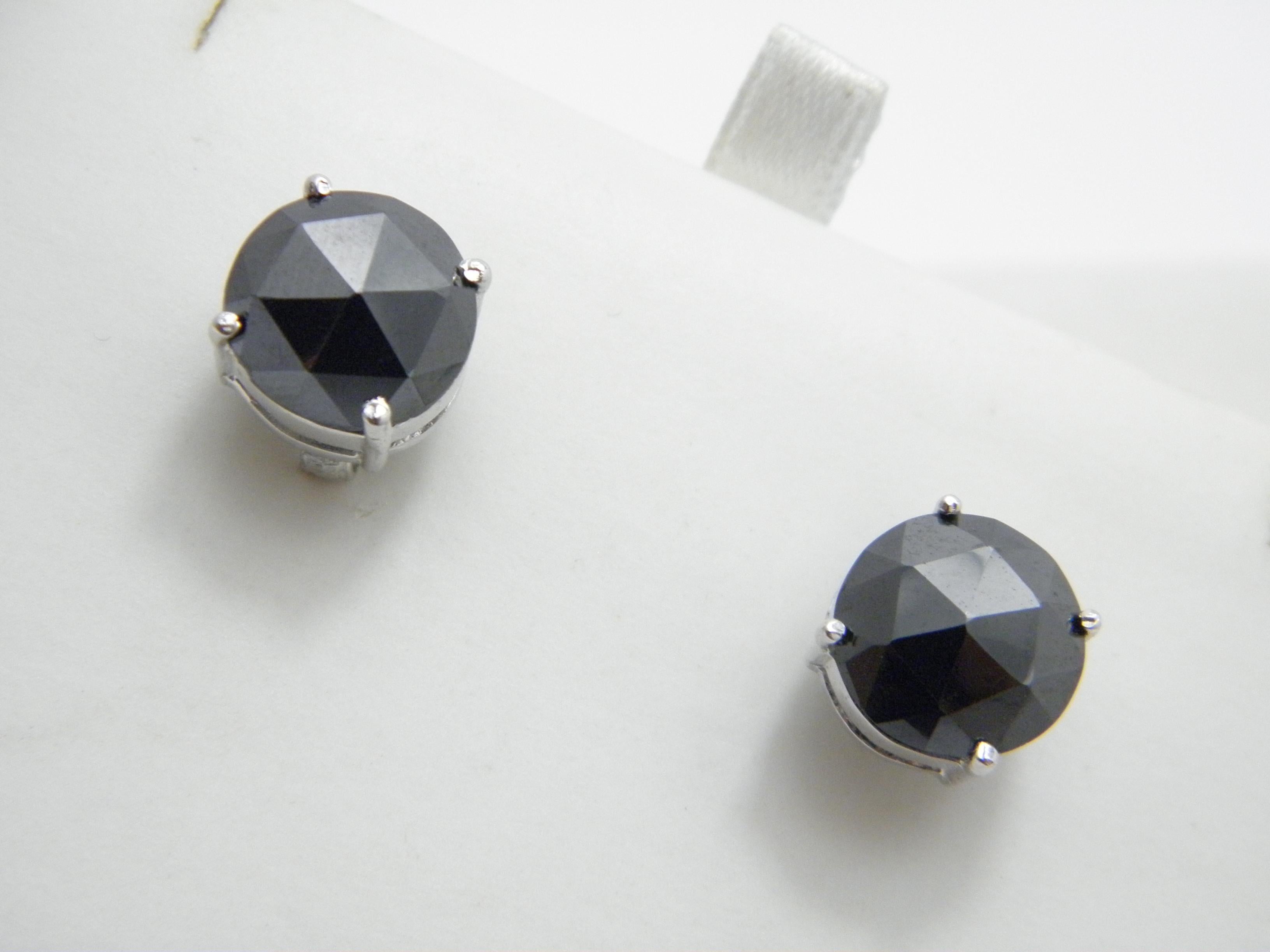 A very special item for you to consider:

LARGE STERLING SILVER 5.0 CARAT BLACK DIAMOND STUD EARRINGS

DETAILS
Material: 925/1000 Sterling Silver
Style: Bespoke made huge diamond stud earrings.
Gems: Round facet cut natural black diamonds (Australia