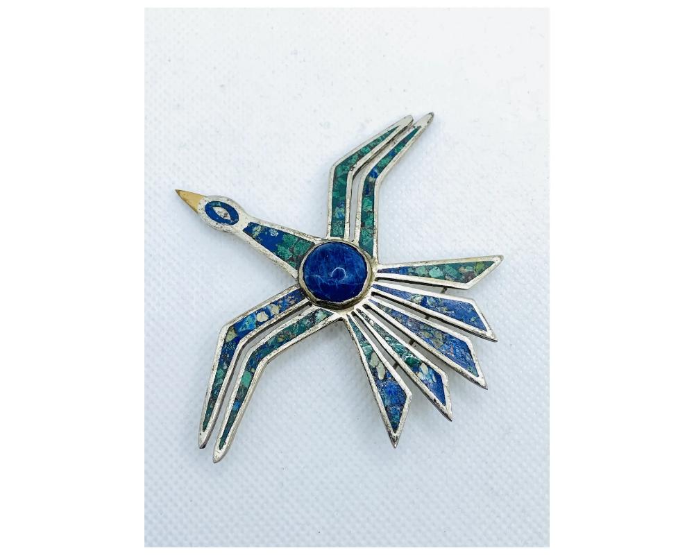 Vintage Sterling Silver 925 Cecilia Tono Mexican Turquoise Pendant Thunderbird 
condition is consistant with age some minor wear and and use 
over all in good condition 
this can be worn as a pendant on a chain or as a brooch 
size is approximately