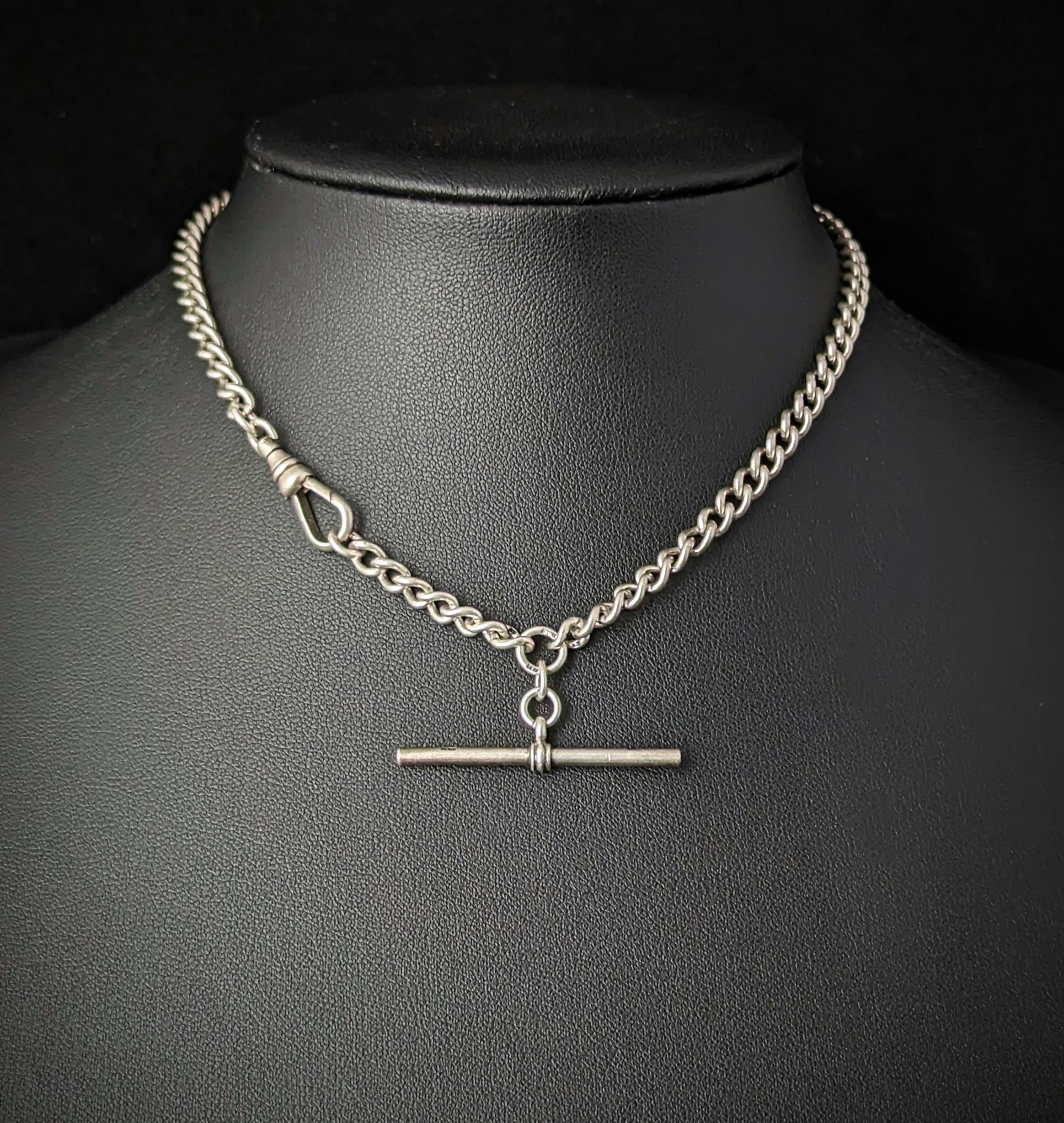 An attractive vintage sterling silver Albert chain or watch chain.

Nice silver graduated curb links with a dog clip fastener to one end and a t bar to the other.

The chain is made from sterling silver and the fittings are also solid silver.

A