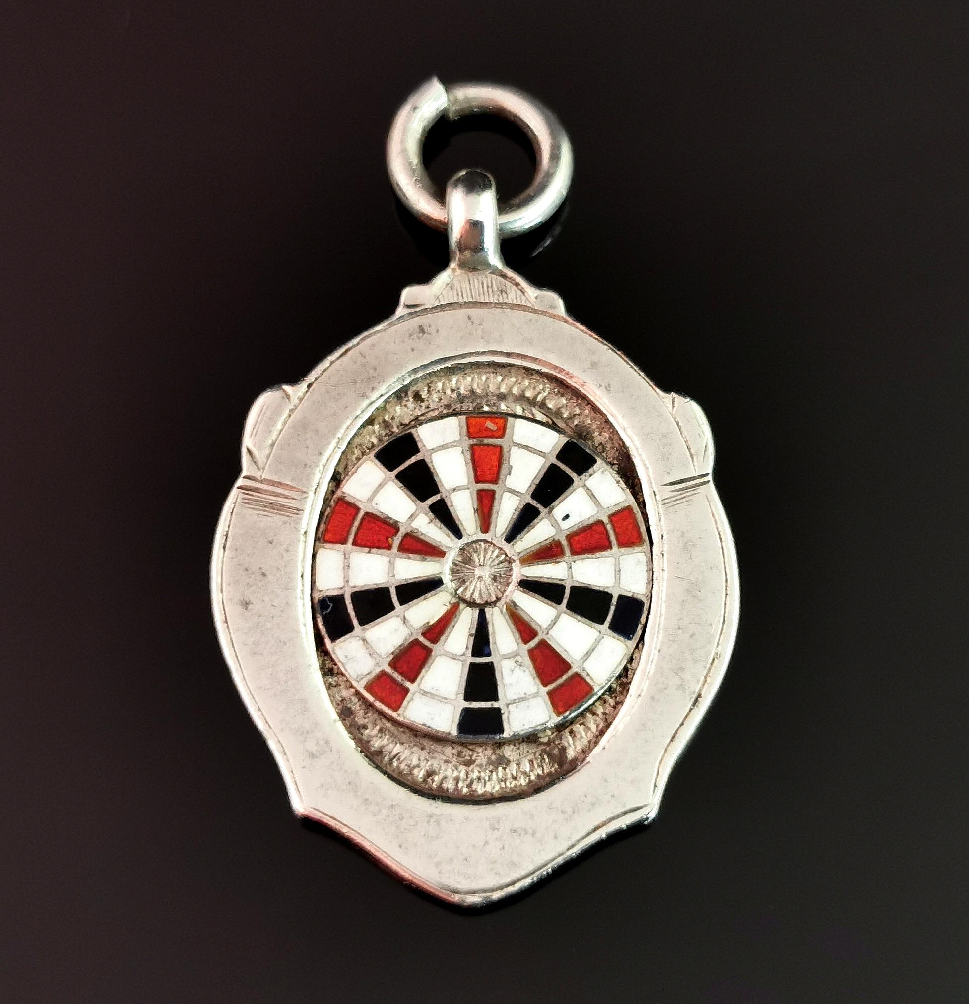 A fantastic vintage 1930's sterling silver and enamel watch fob.

This fob features an enamelled dart board with red, white and blue sections.

An unusual and very well detailed watch fob, these also look great worn as pendants and this one really