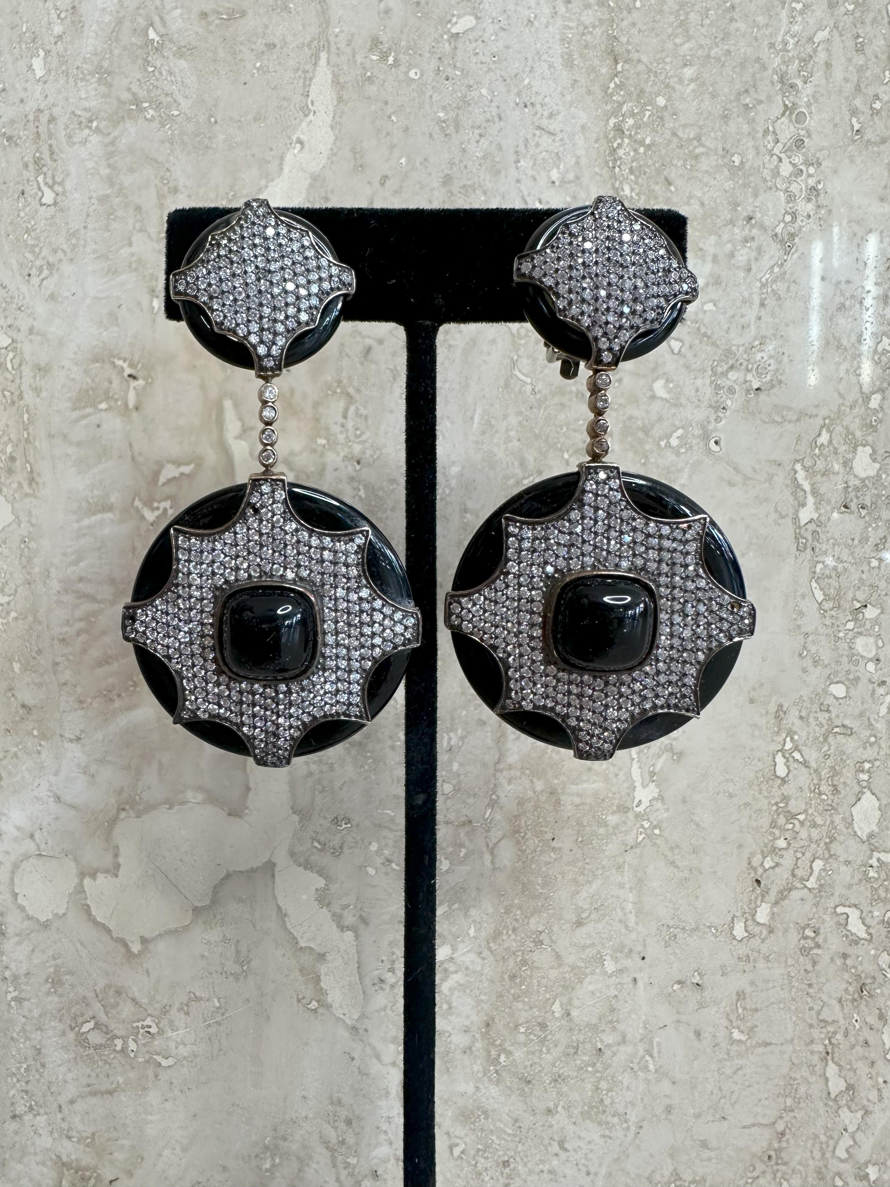 Vintage Sterling Silver Black Rhinestone Clip-On Earrings are a chic and elegant choice for anyone who loves the charm of vintage jewelry, combined with the glam of rhinestones. These earrings are likely to have a timeless appeal, with a design that