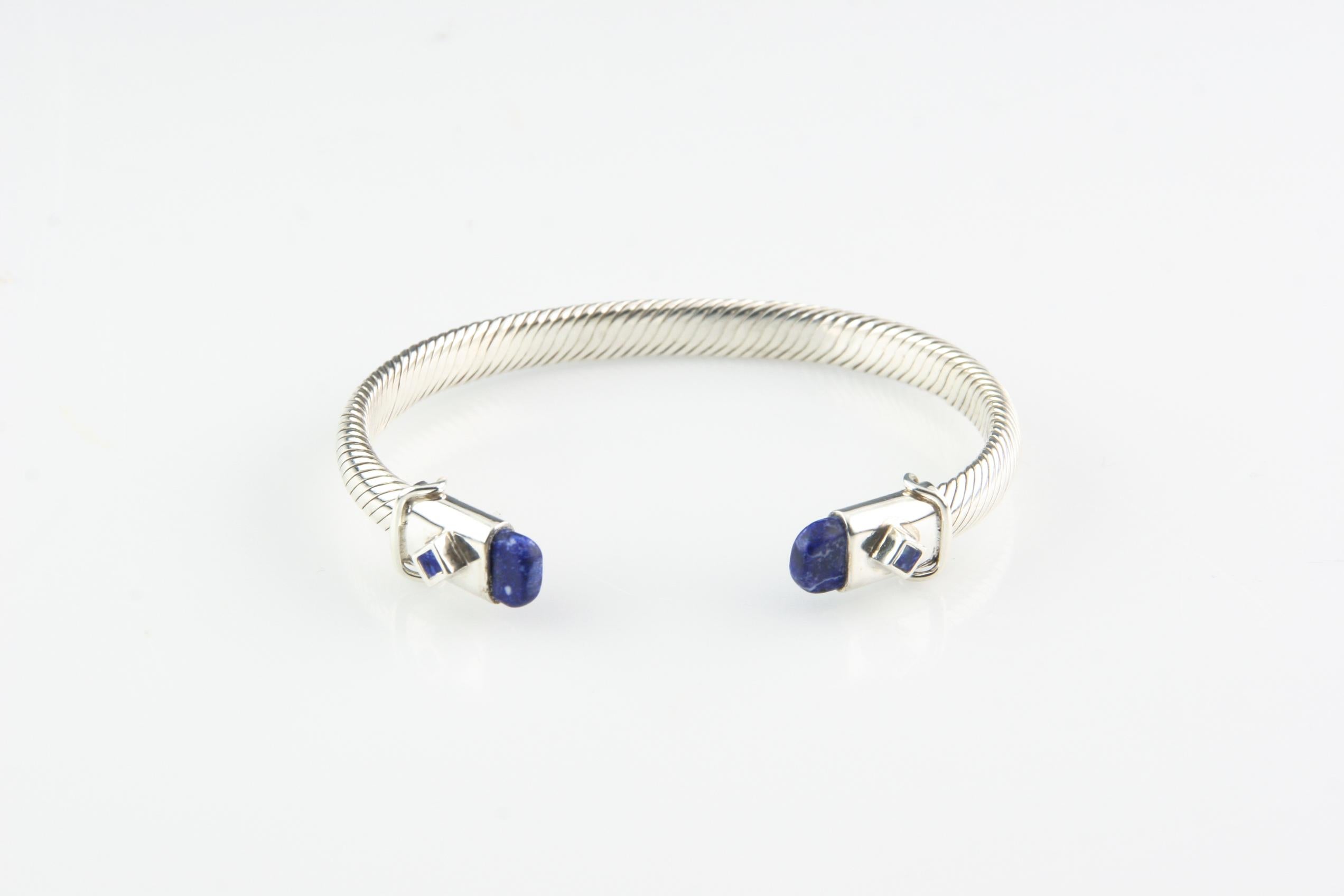 Gorgeous Sterling Silver Cable Cuff Bracelet
Ends of Bracelet are Capped in Lapis
Inner Circumference (Wrist Fit) = 7
