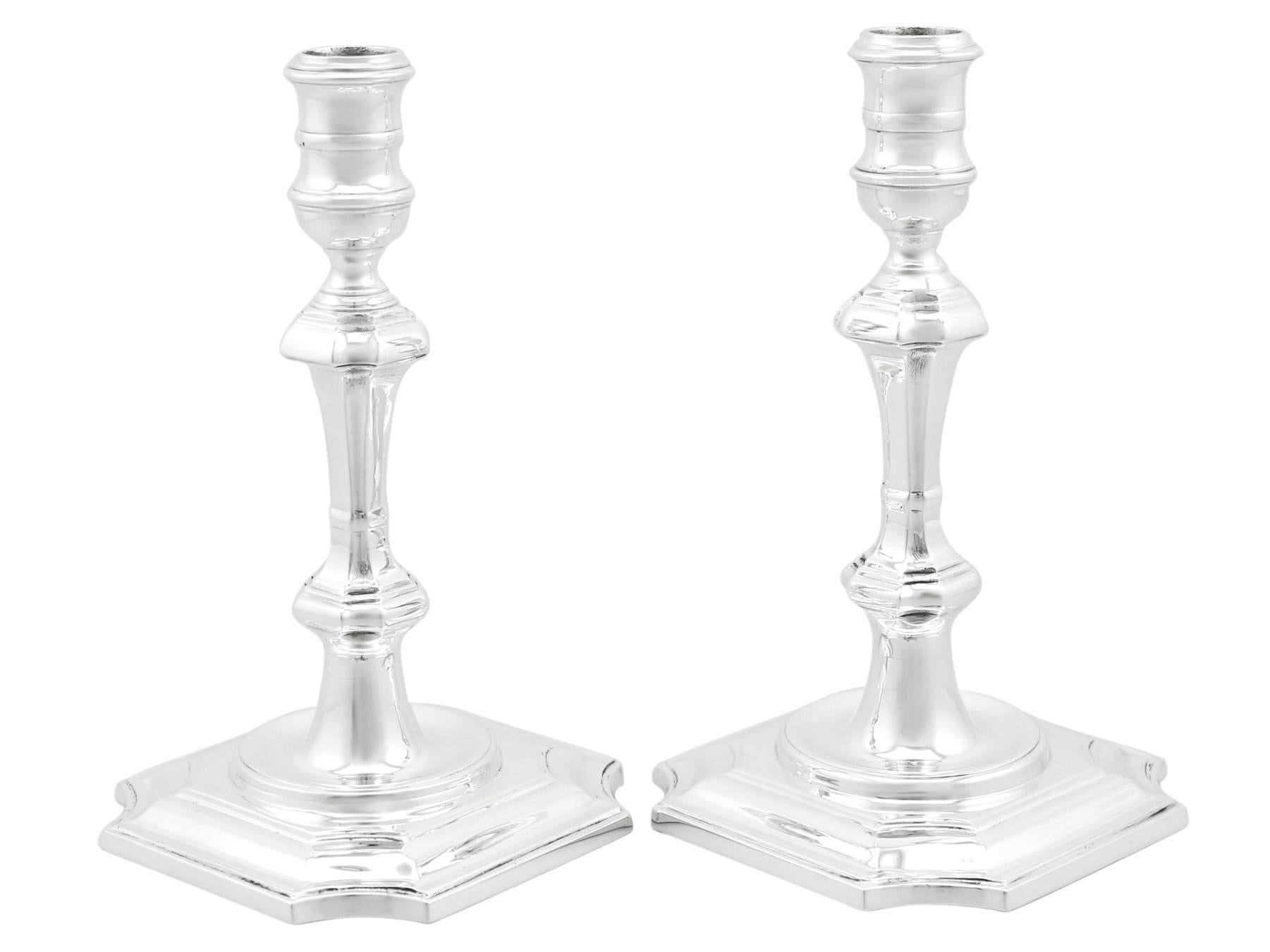 An exceptional, fine and impressive pair of vintage English cast sterling silver candlesticks; an addition of our ornamental silverware collection.

These exceptional vintage English sterling silver candlesticks have a plain classical 18th century